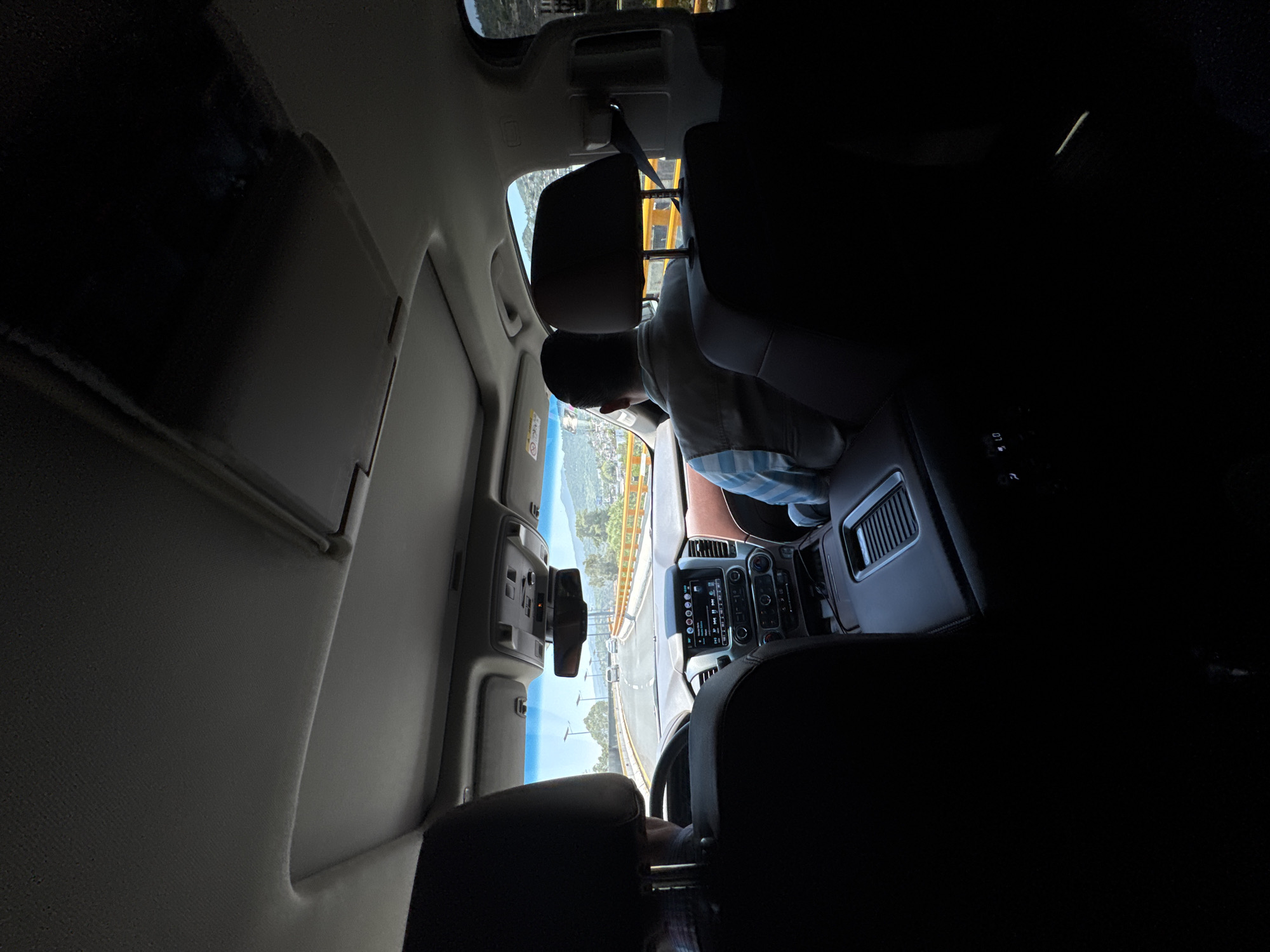 Passenger documents sunny afternoon drive on Mexico City winding road