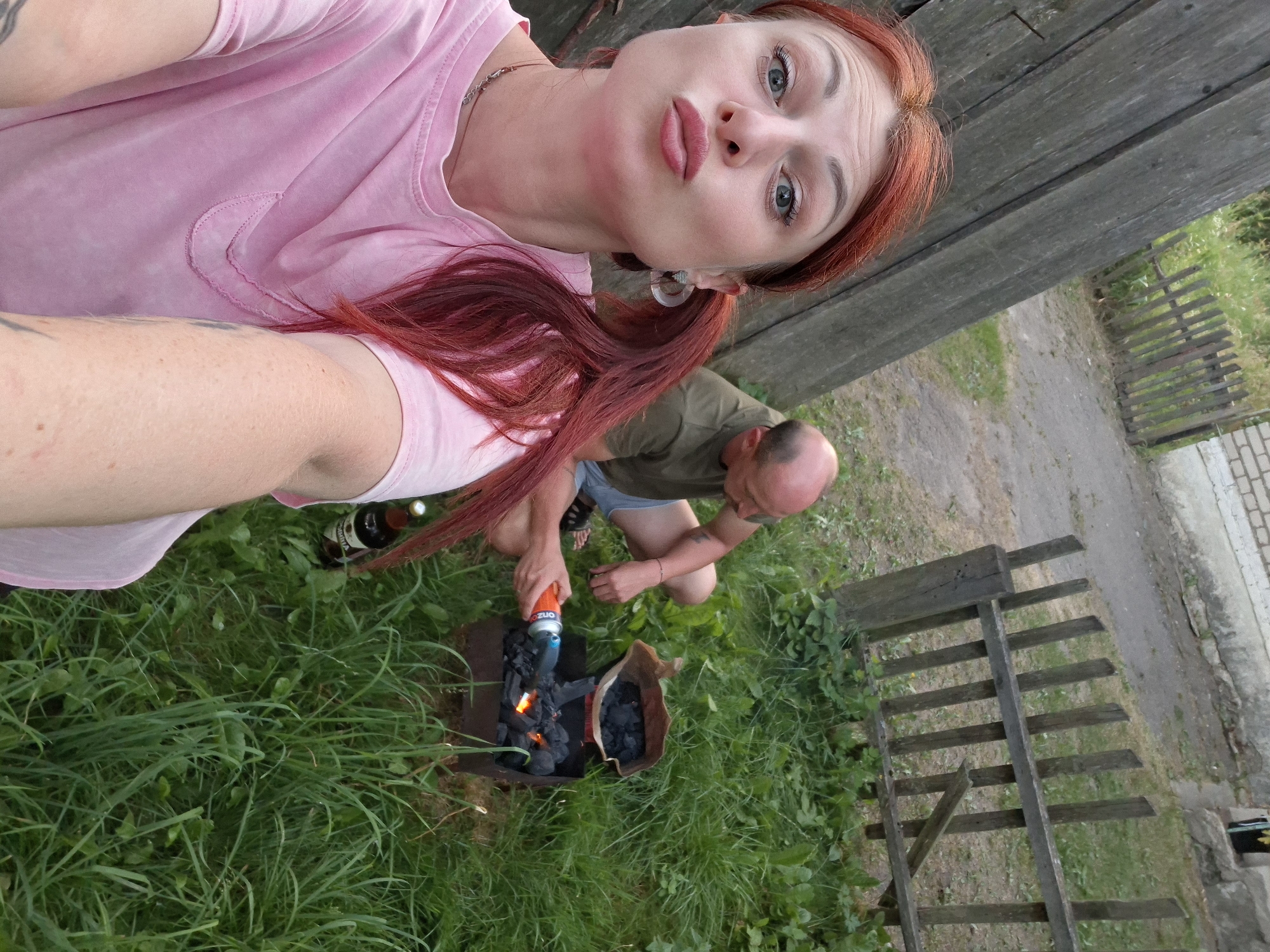 Backyard cookout in rural Belarus, complete with a Sphynx cat