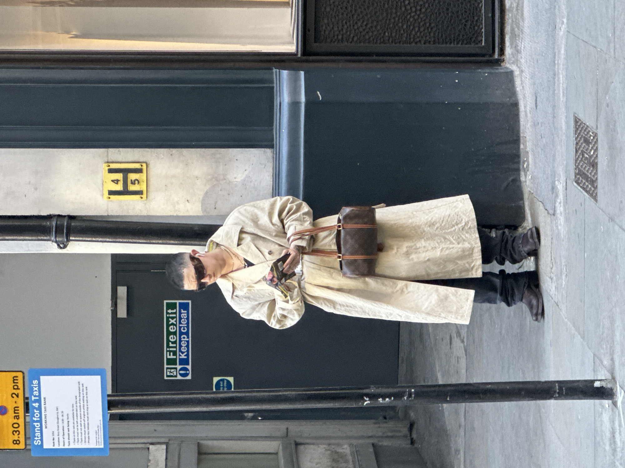 Pedestrians spotted near London's Saatchi Yates gallery district