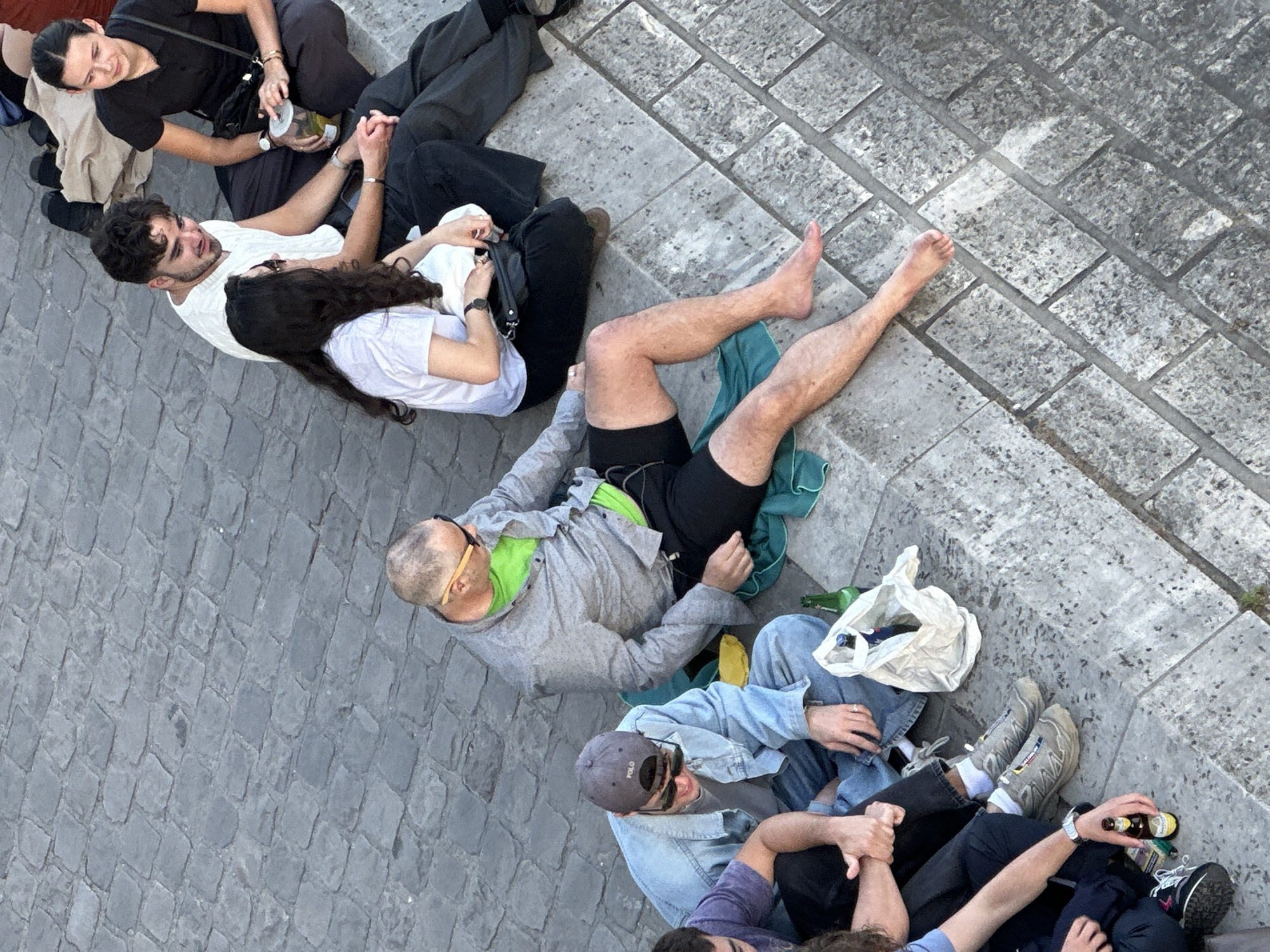 Parisians gather around fabric-wrapped Pont Neuf art installation