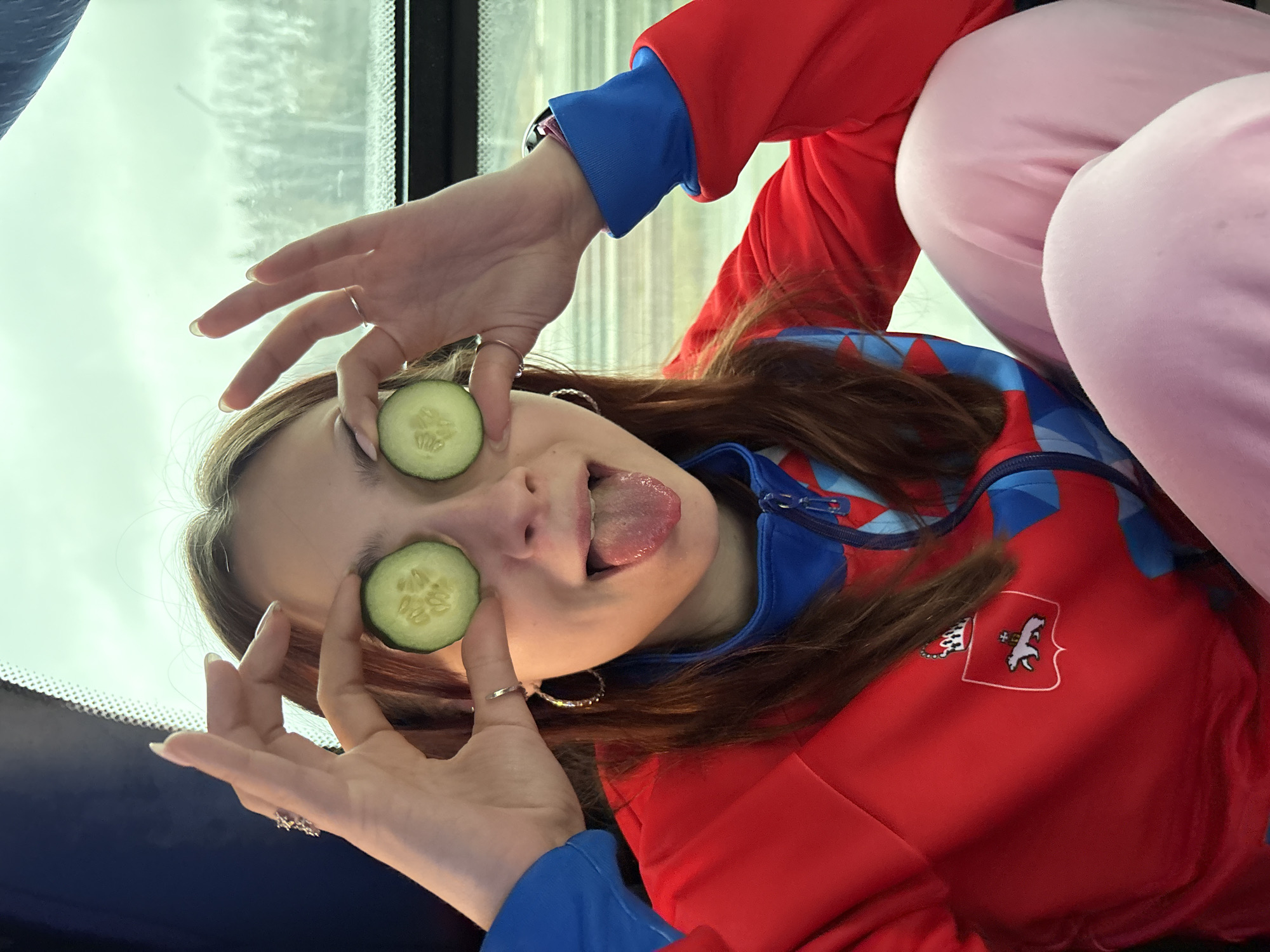 Woman poses with cucumber eye treatment in Yanychi, Russia