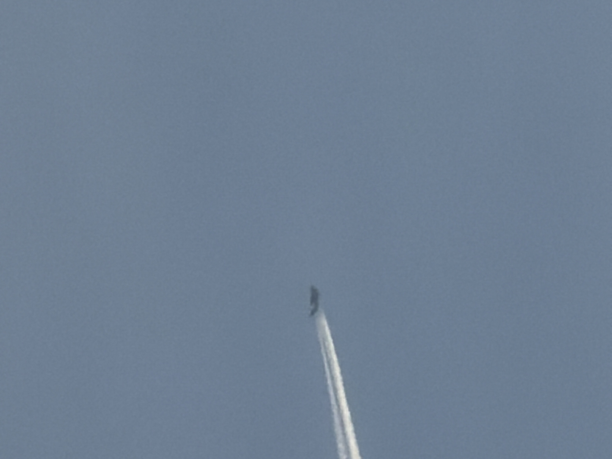 Sky watching session captures contrails and moon over Bulgarian town