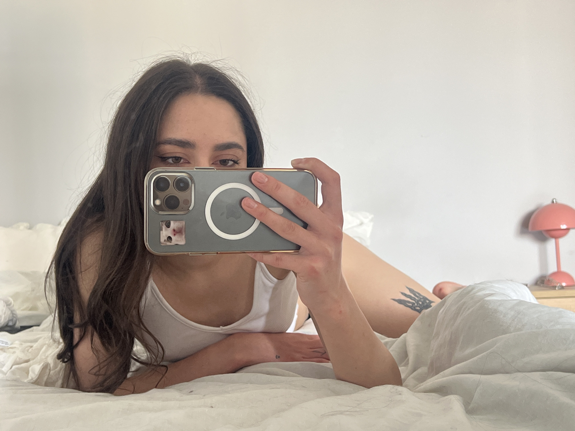 Woman takes selfies in bed in Ternopil, Ukraine