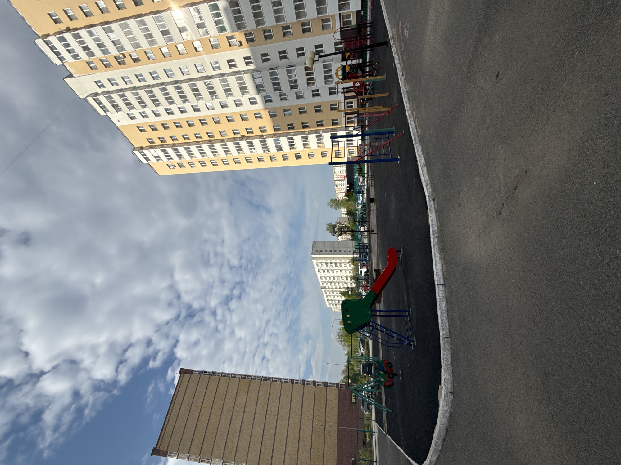 Family playground visit documented in Tobolsk residential area