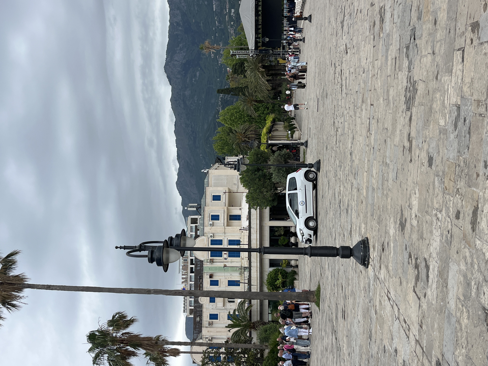 Tourists explore Budva's old town on cloudy morning
