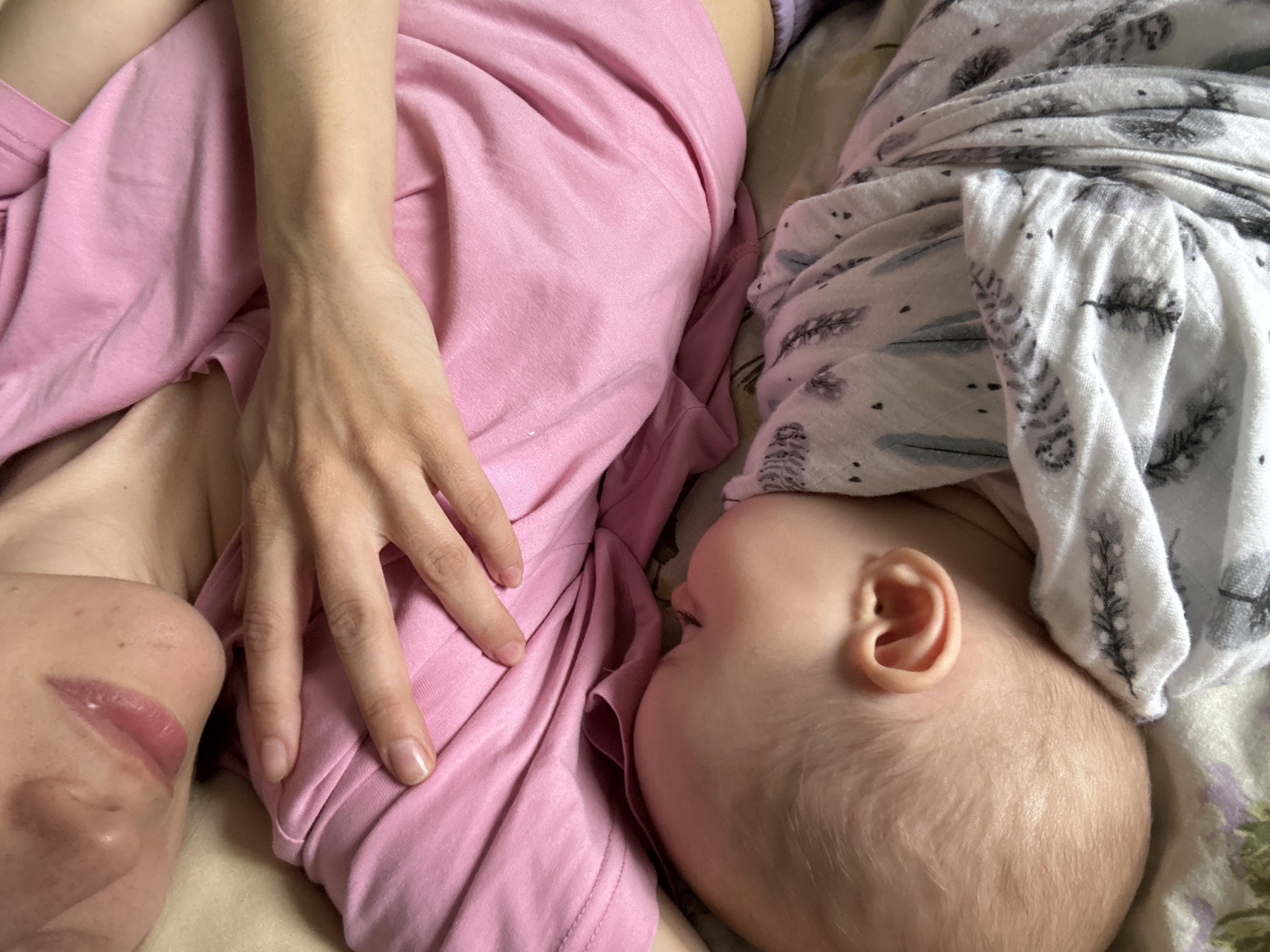 Parent and baby rest together in Moscow morning scene