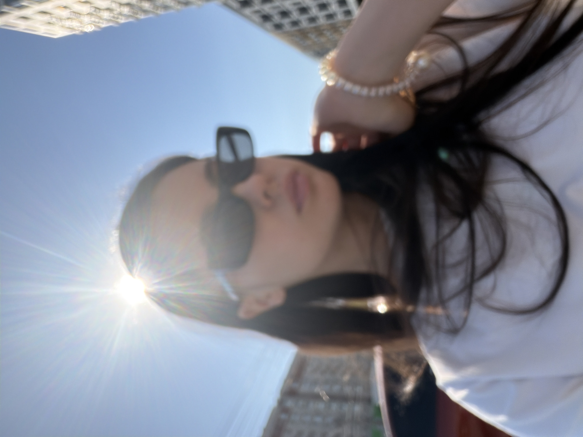 Woman takes selfies around Izhevsk during sunny spring morning