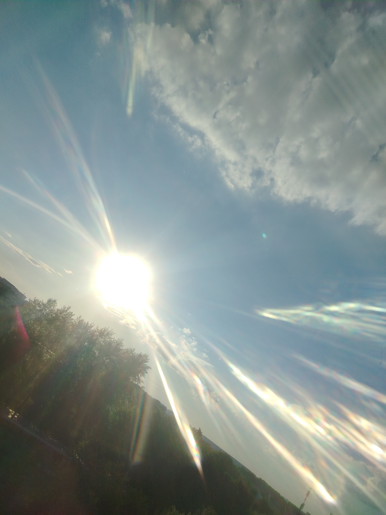 Bright sun creates lens flares over Podolsk, Russia