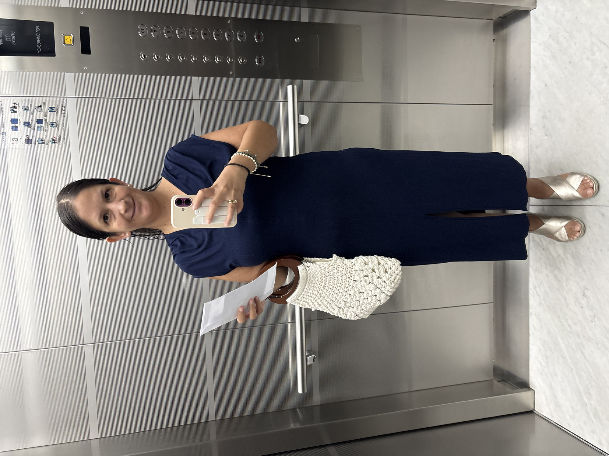 Woman takes elevator selfie in San Isidro, Peru
