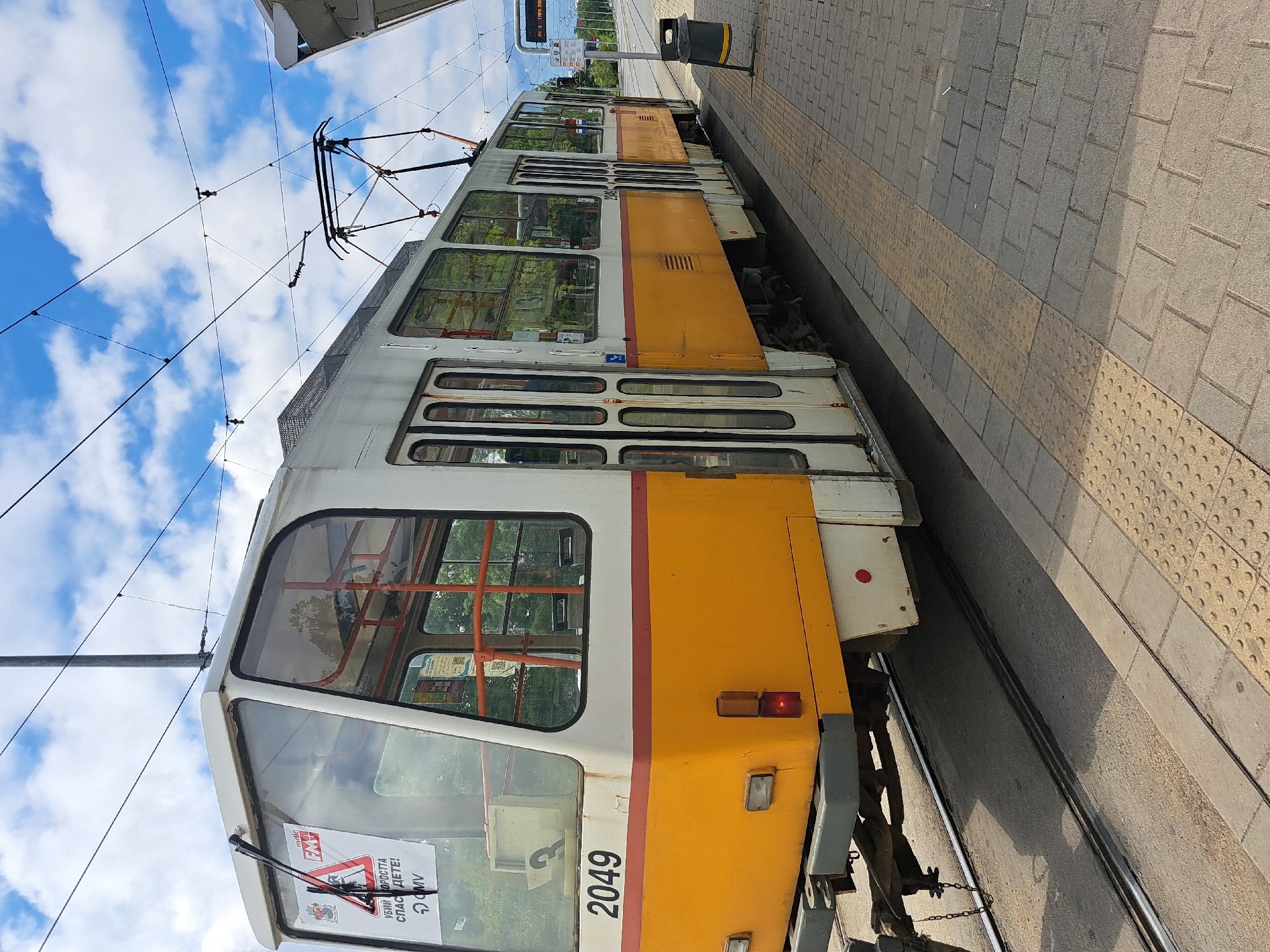 Tram 2049 stops at Sofia platform with tactile paving