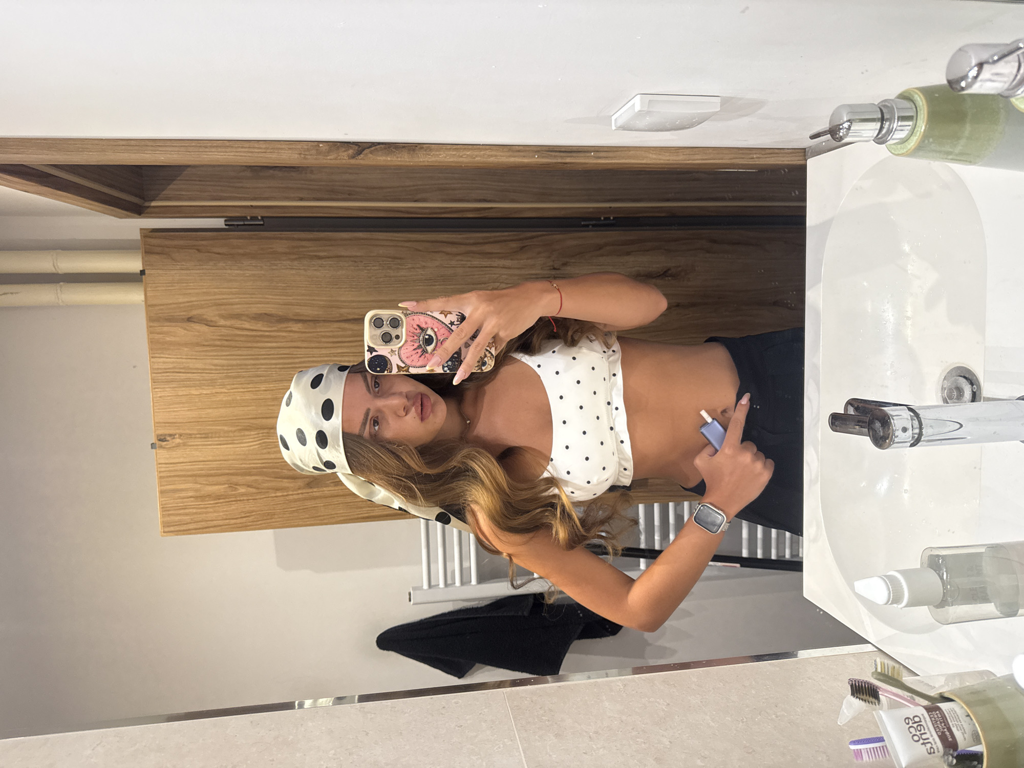 Polka dot mirror selfies in a Plovdiv bathroom
