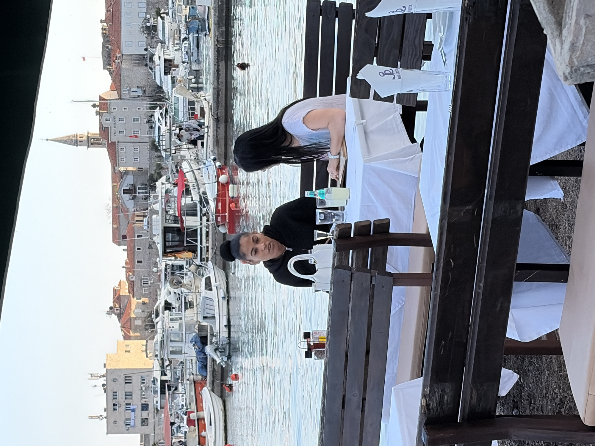 Afternoon life captured around Budva marina and waterfront cafes