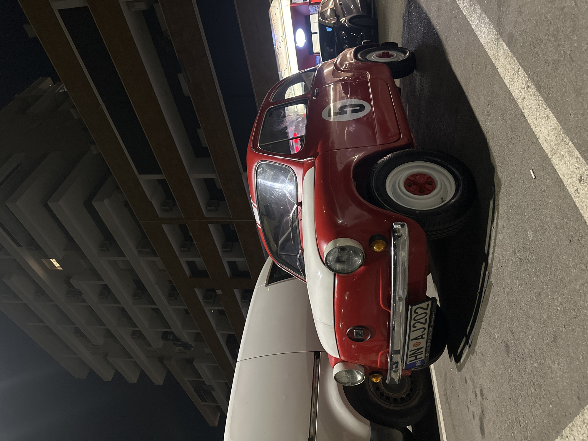 Budva at 3am: moon, old Fiat, and a city winding down