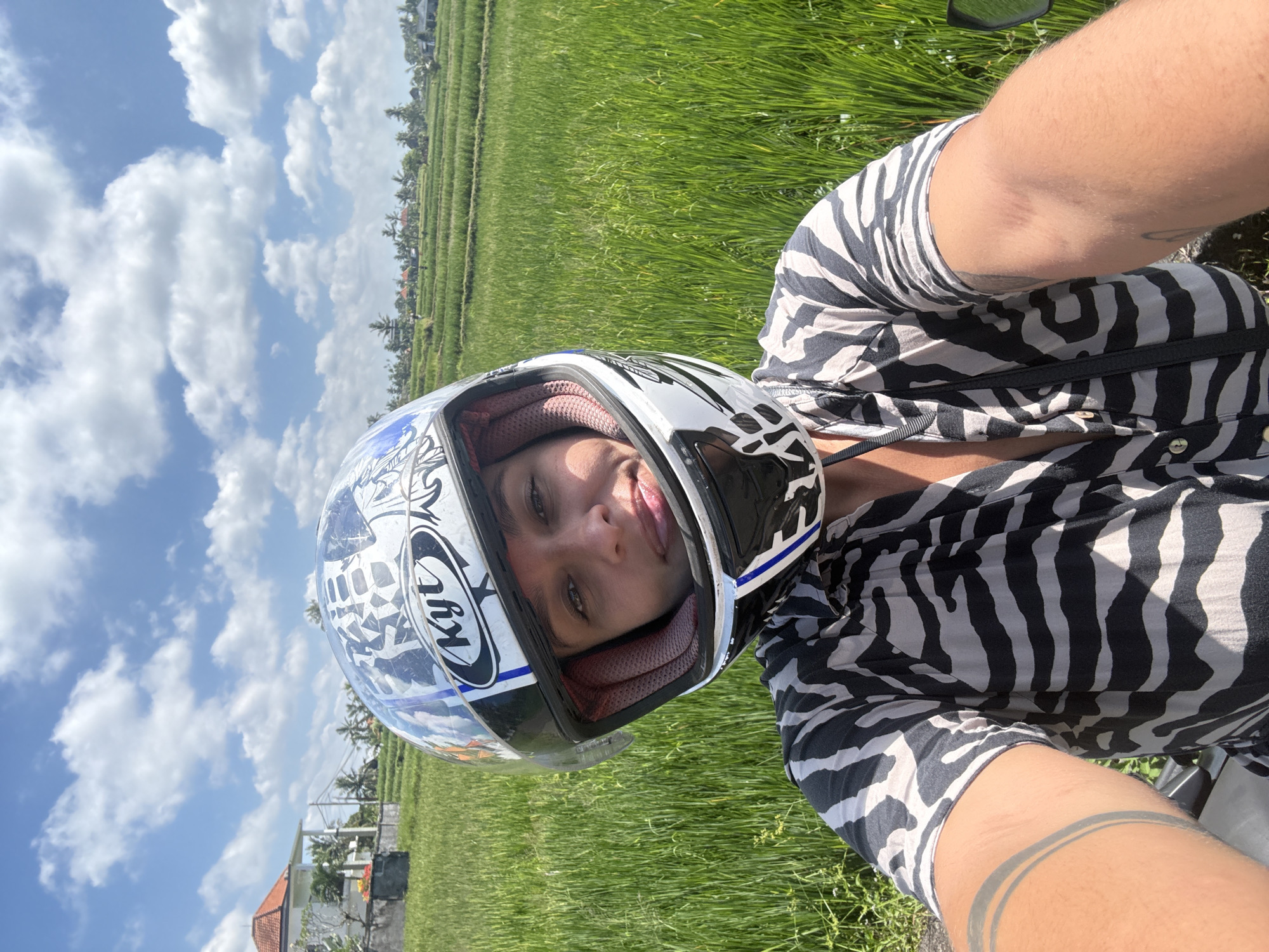 Motorcyclist documents rural journey through Indonesian rice fields