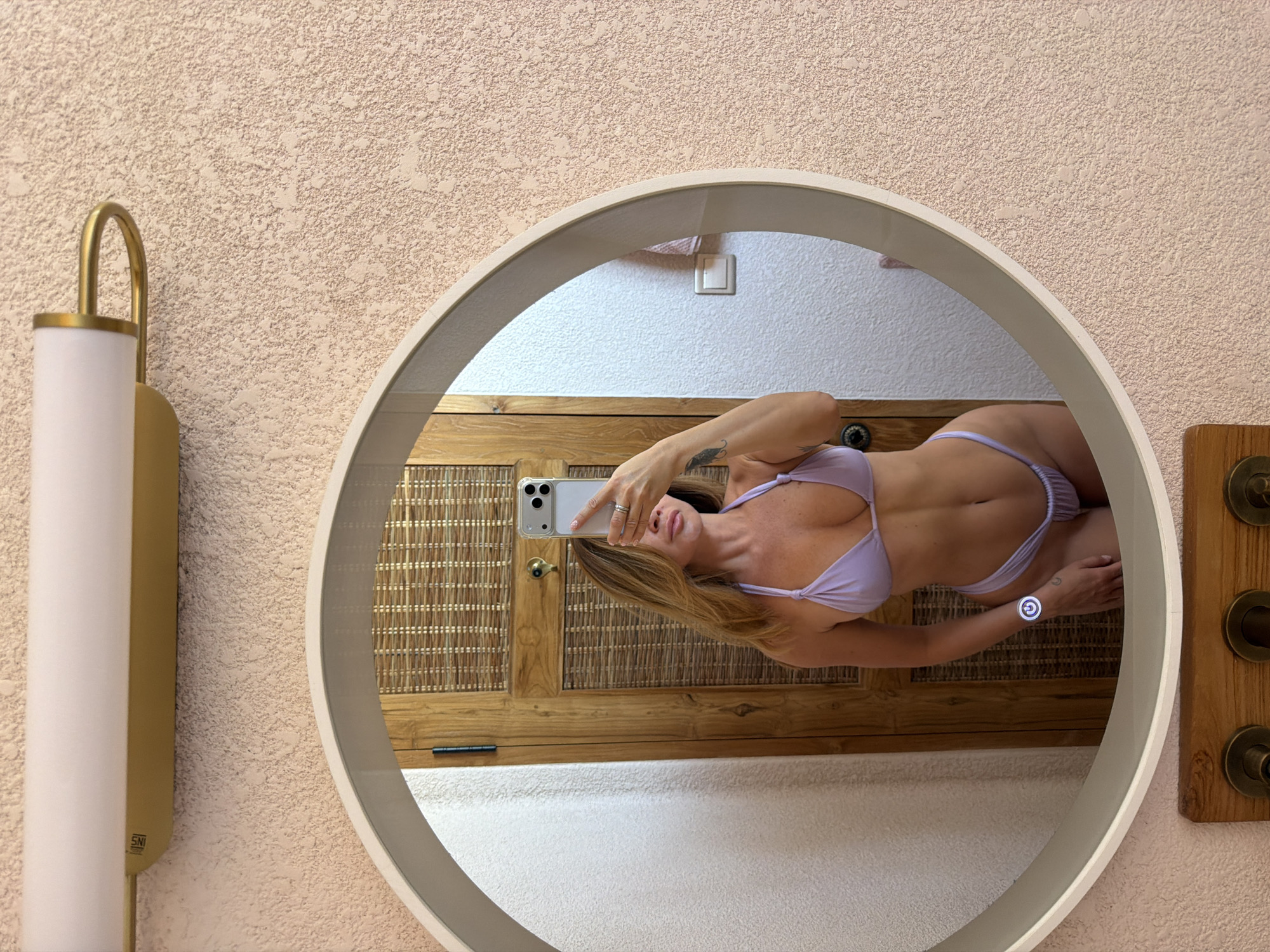 Woman takes mirror selfies in Mengwi, Indonesia