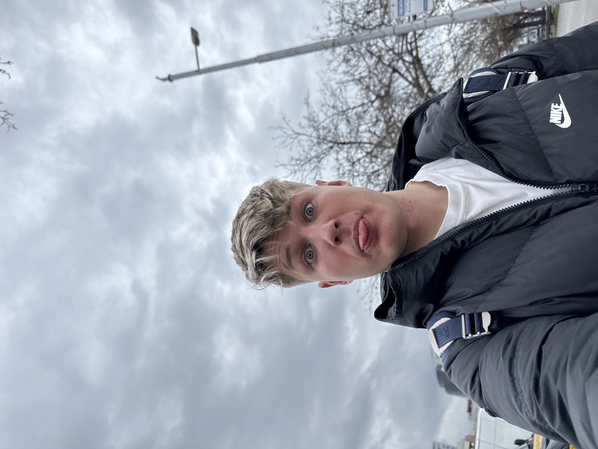 Young man walks dog, takes selfies in Plovdiv park