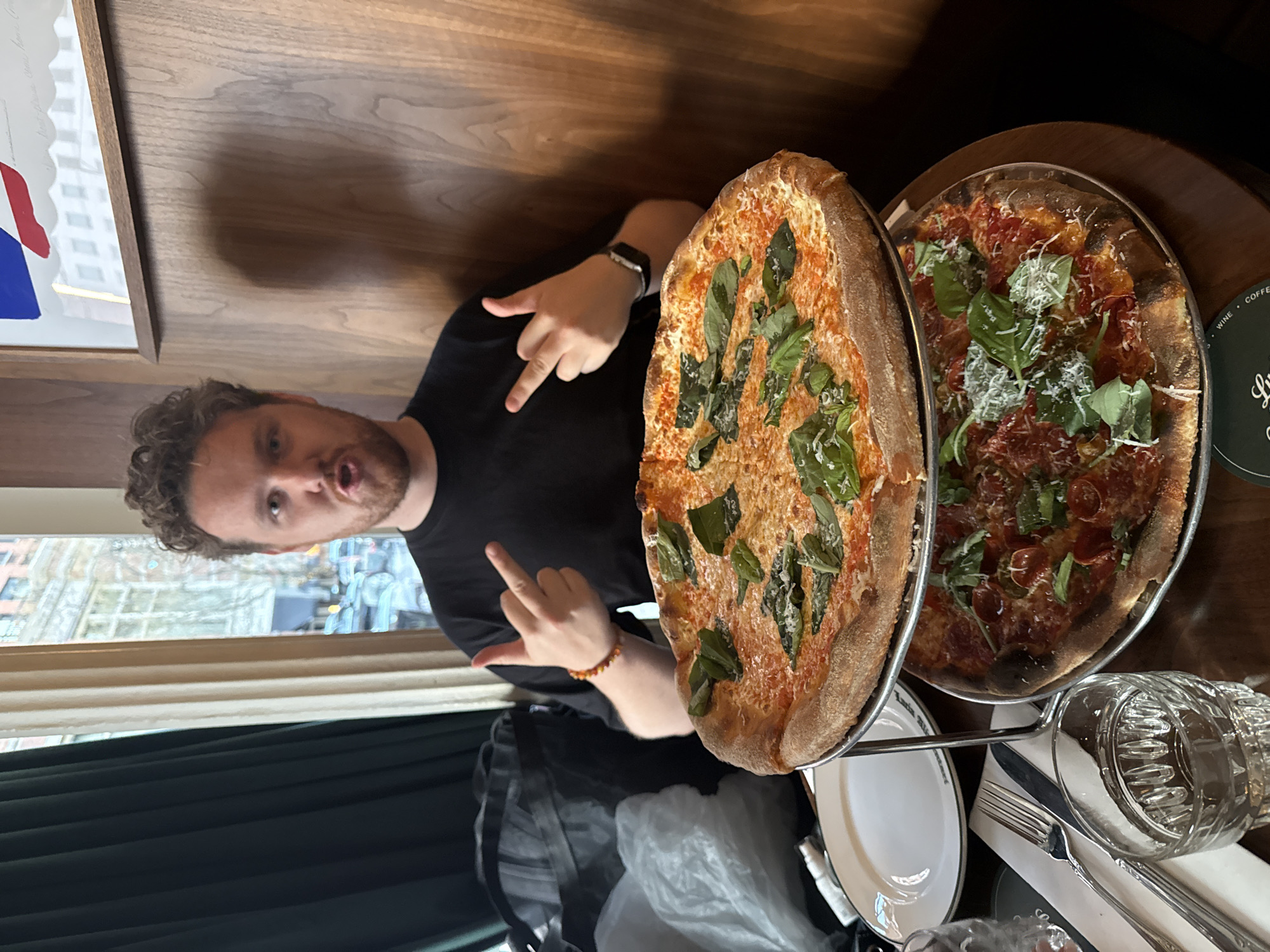Diners gesture and celebrate at NYC restaurant