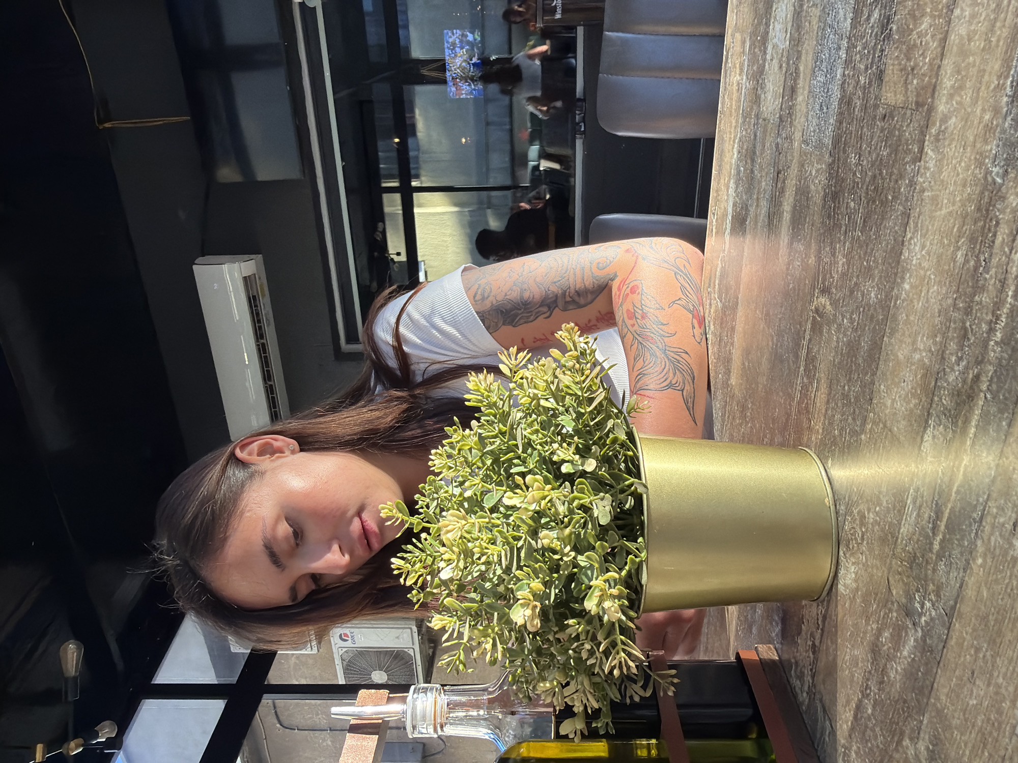 Woman enjoys playful dining moment in Pernik restaurant