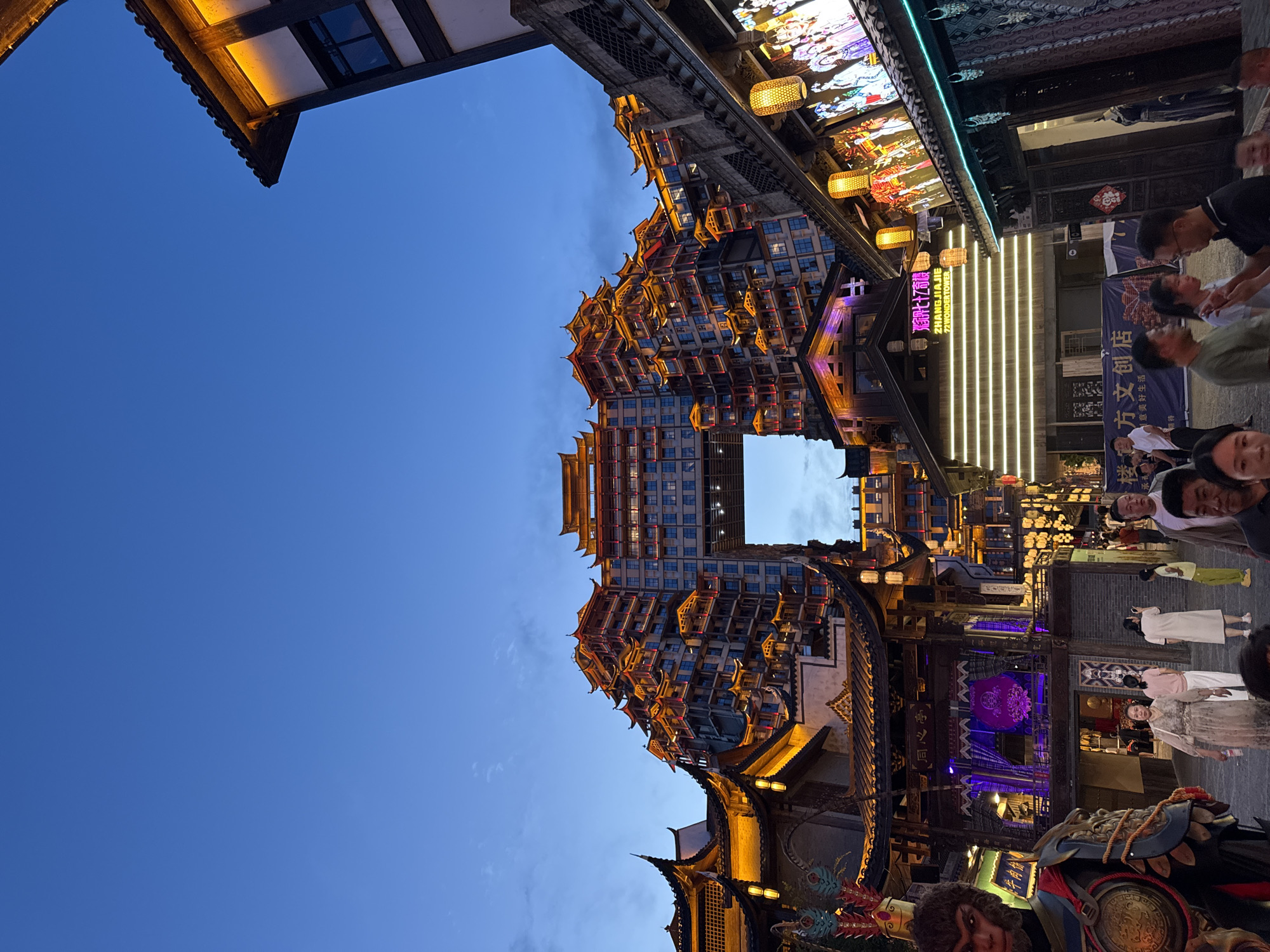 Zhangjiajie's lantern-lit streets at dusk, Monkey King theme throughout