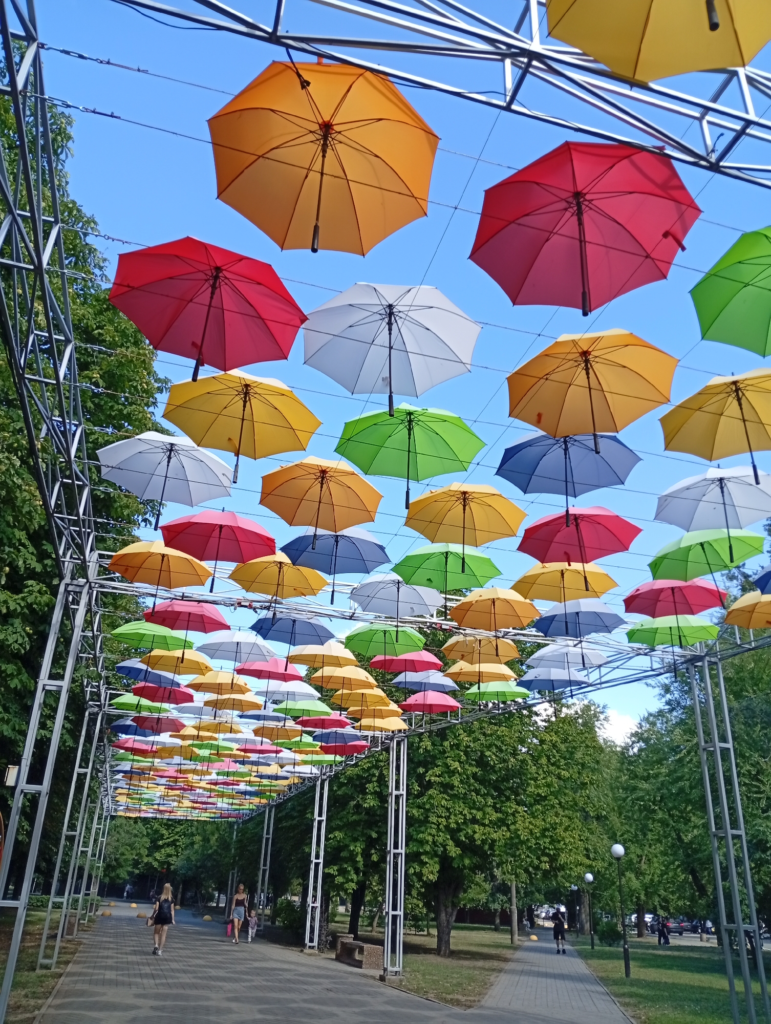 Colorful umbrella walkway and open skies in Pokrov, Ukraine