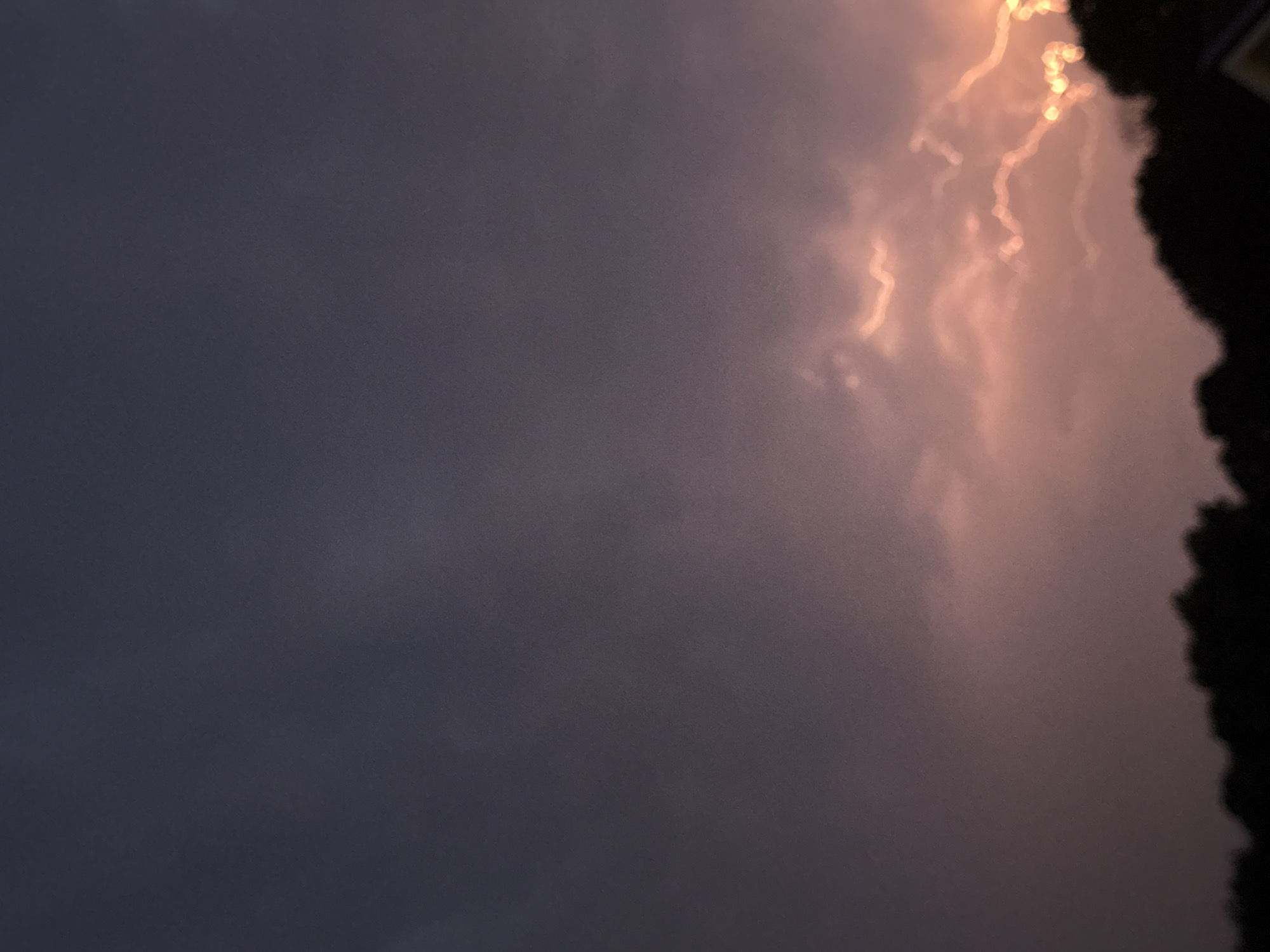 Lightning and a full moon over Putten during a summer storm