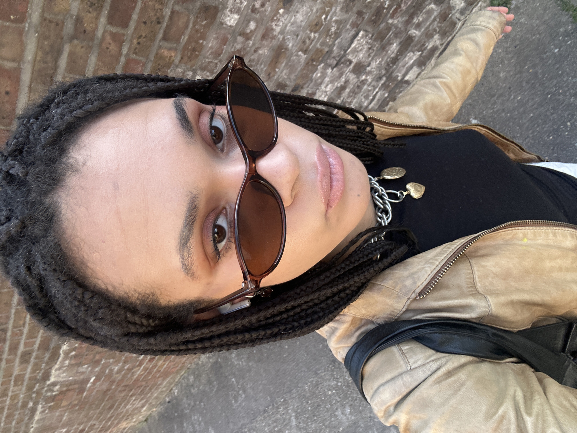 Person photographed near brick building in central London
