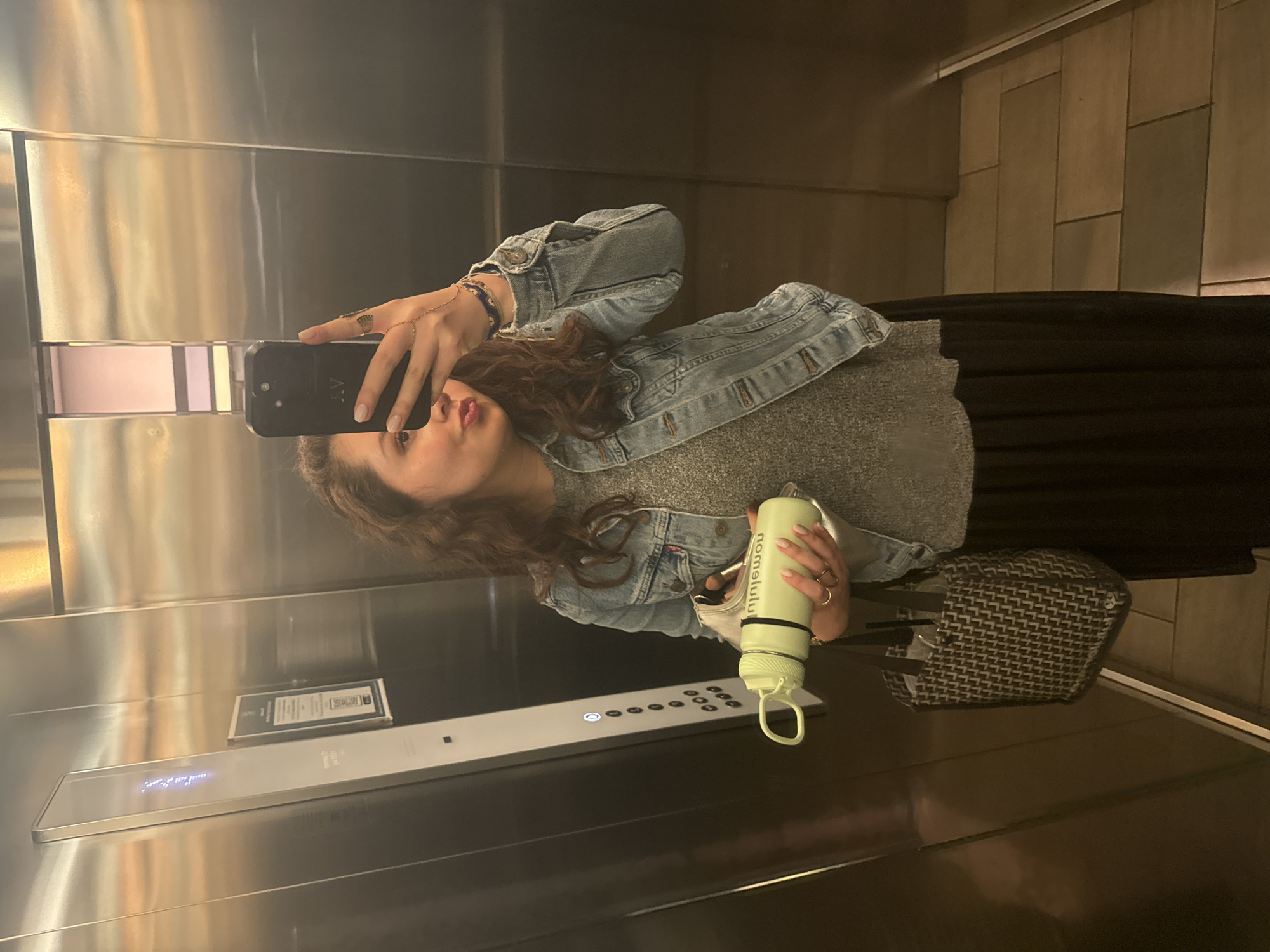 Woman takes early morning elevator selfie in Mexico City