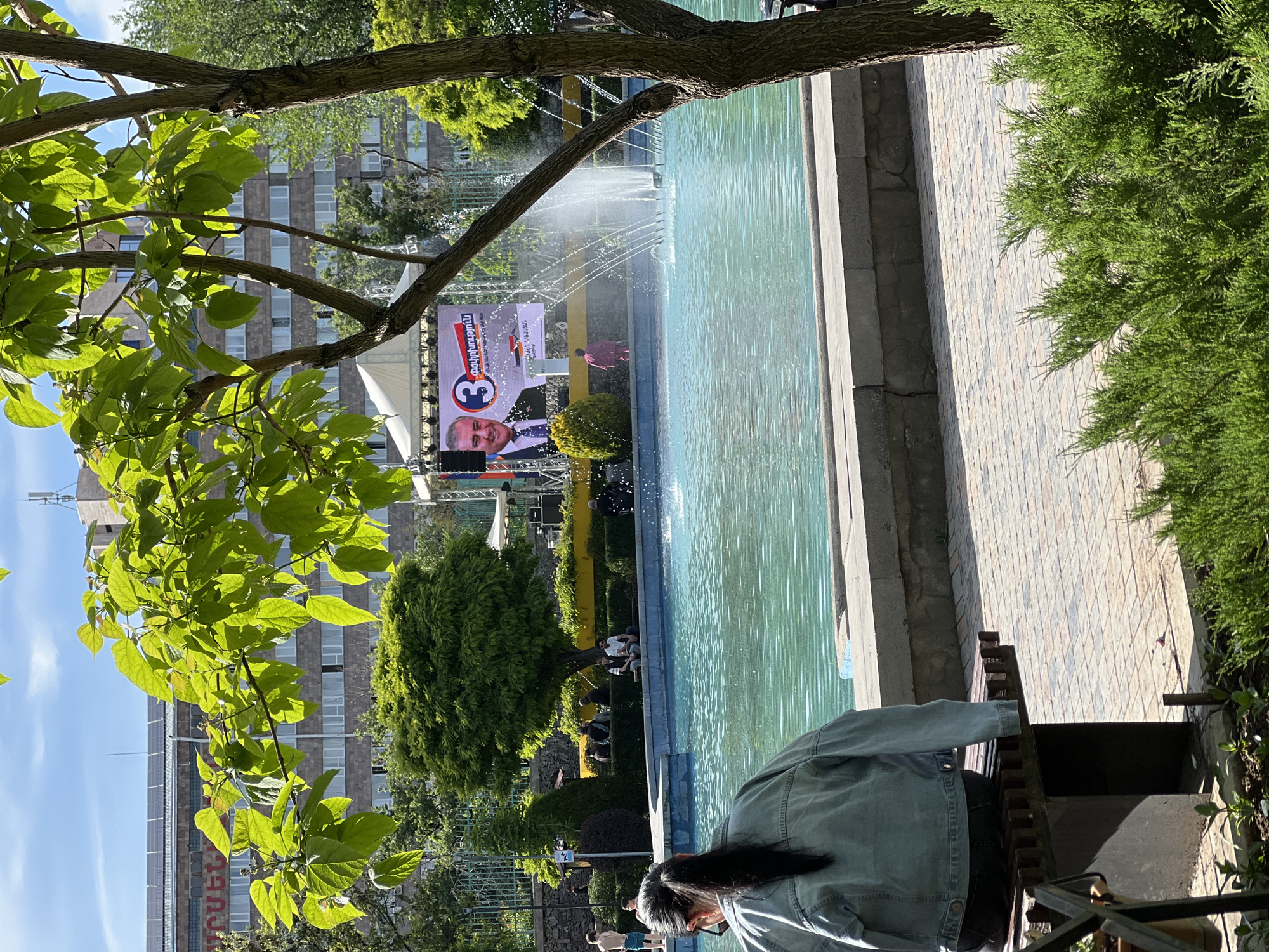 Afternoon park life captured around Yerevan fountain and pond