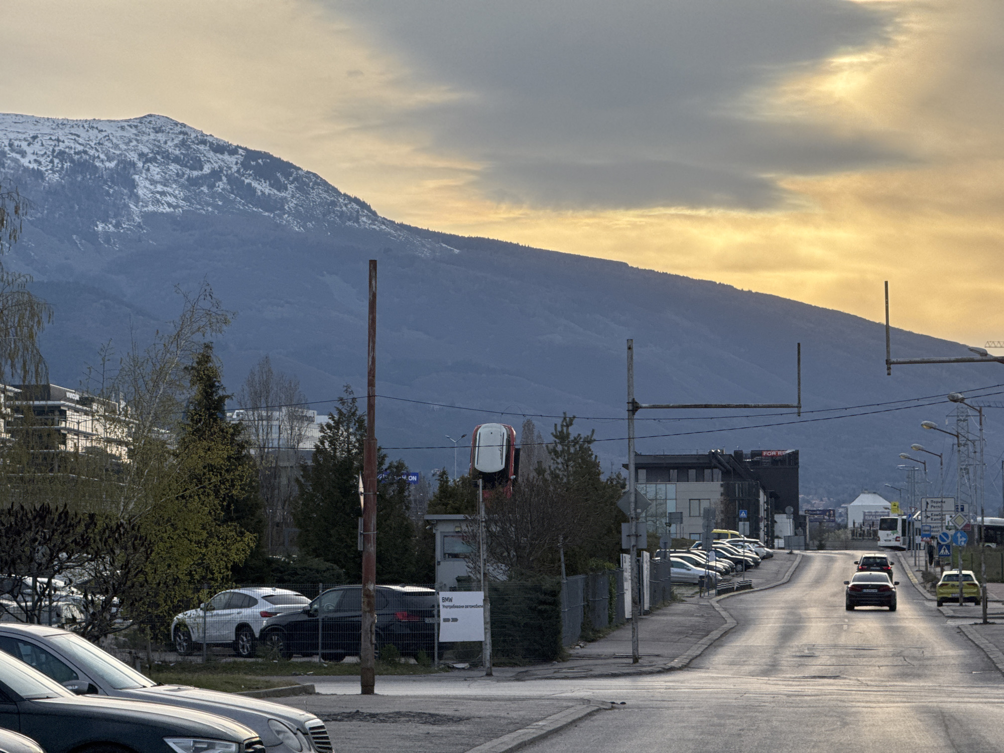 Ordinary street scene captured in Sofia with mountain backdrop