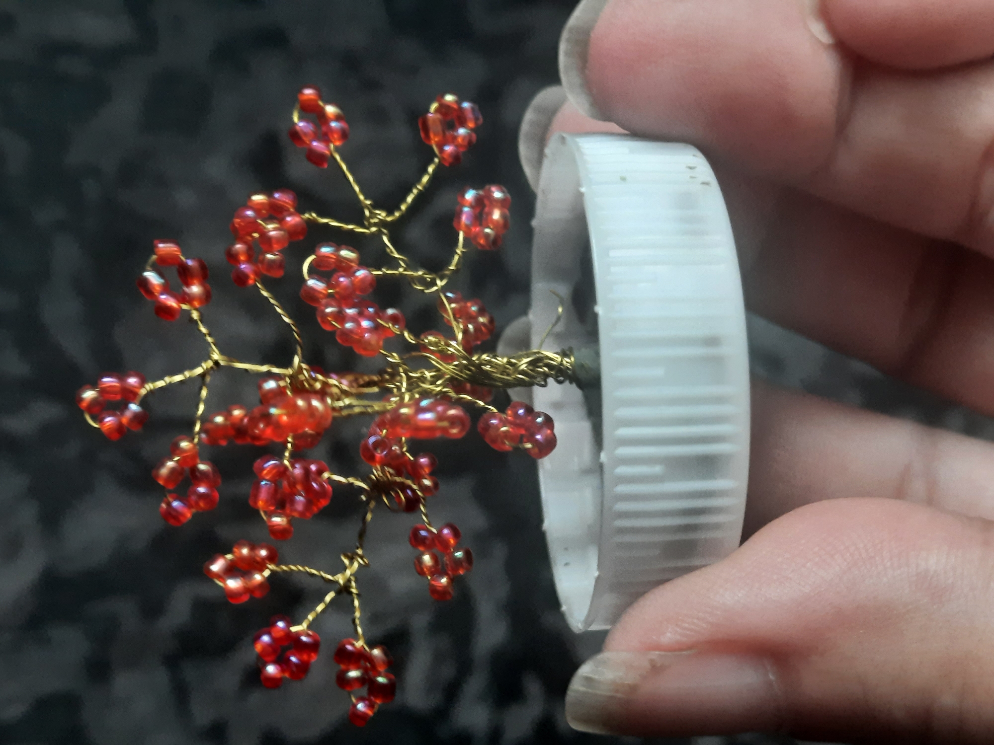 Handmade beaded tree ornament displayed in Sluck, Belarus