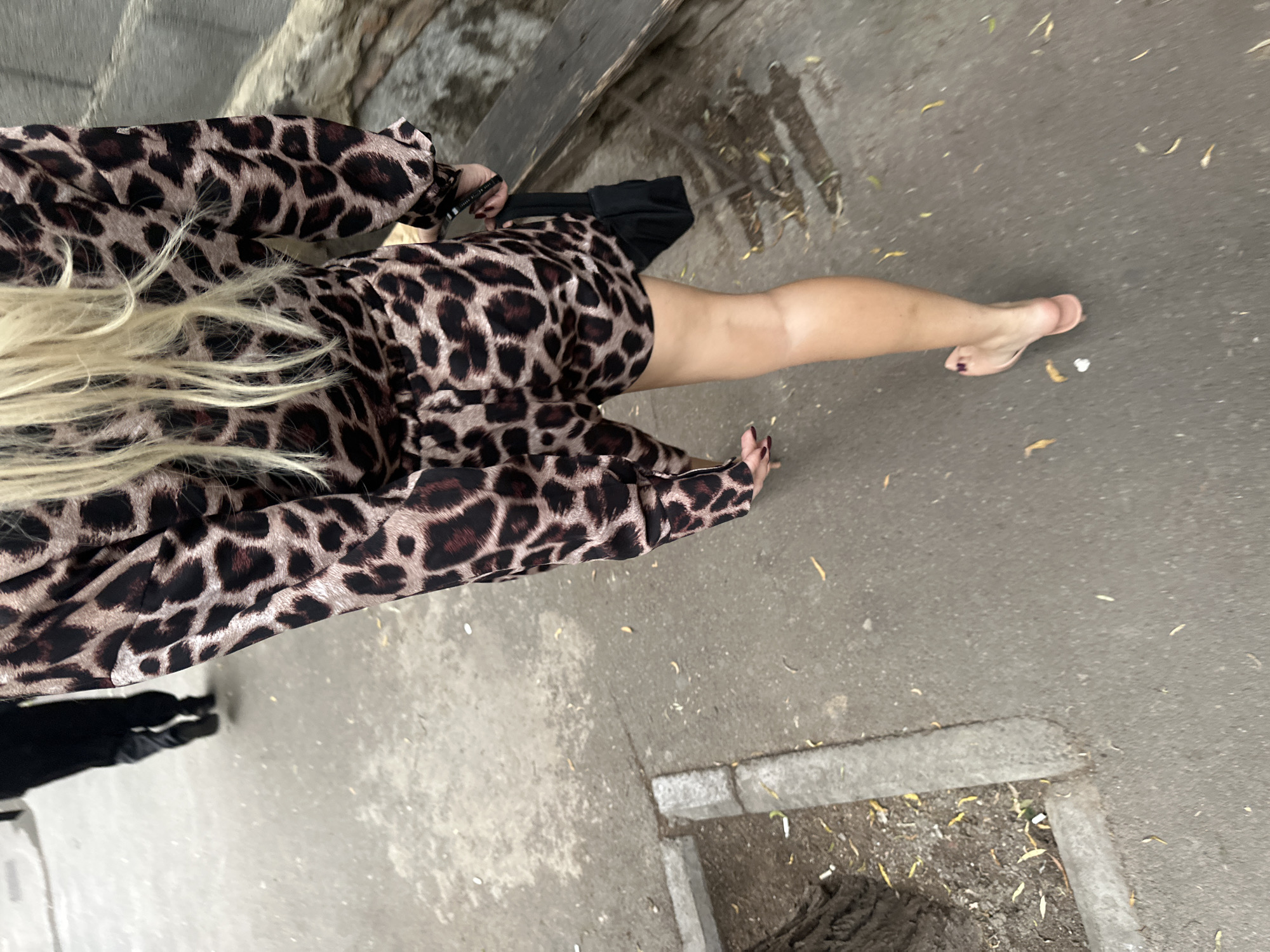 Barefoot in leopard print on a Tbilisi sidewalk