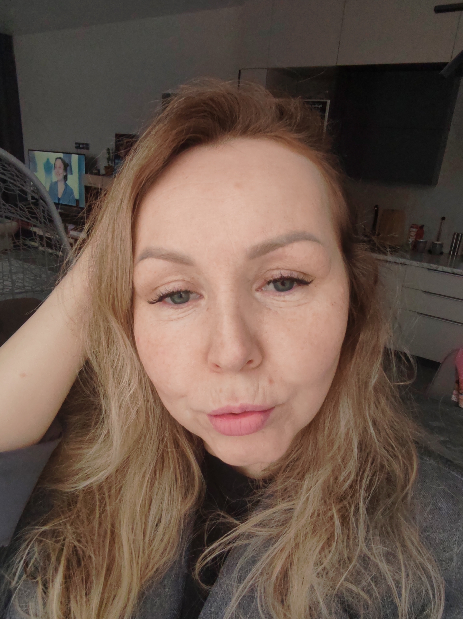 Woman documents personal moments at home in Chaikovsky