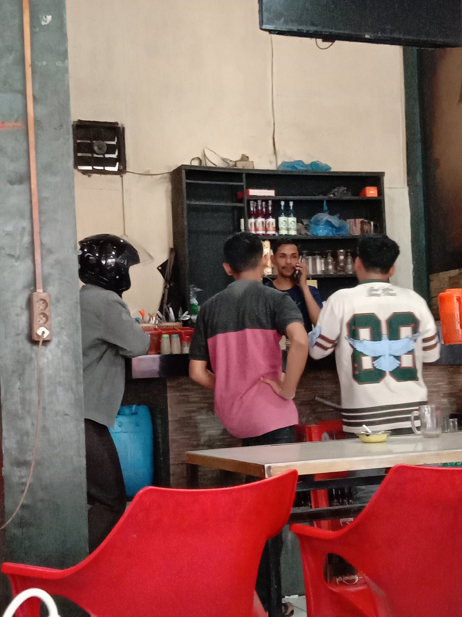 Inside a relaxed local coffee shop in Lhokseumawe