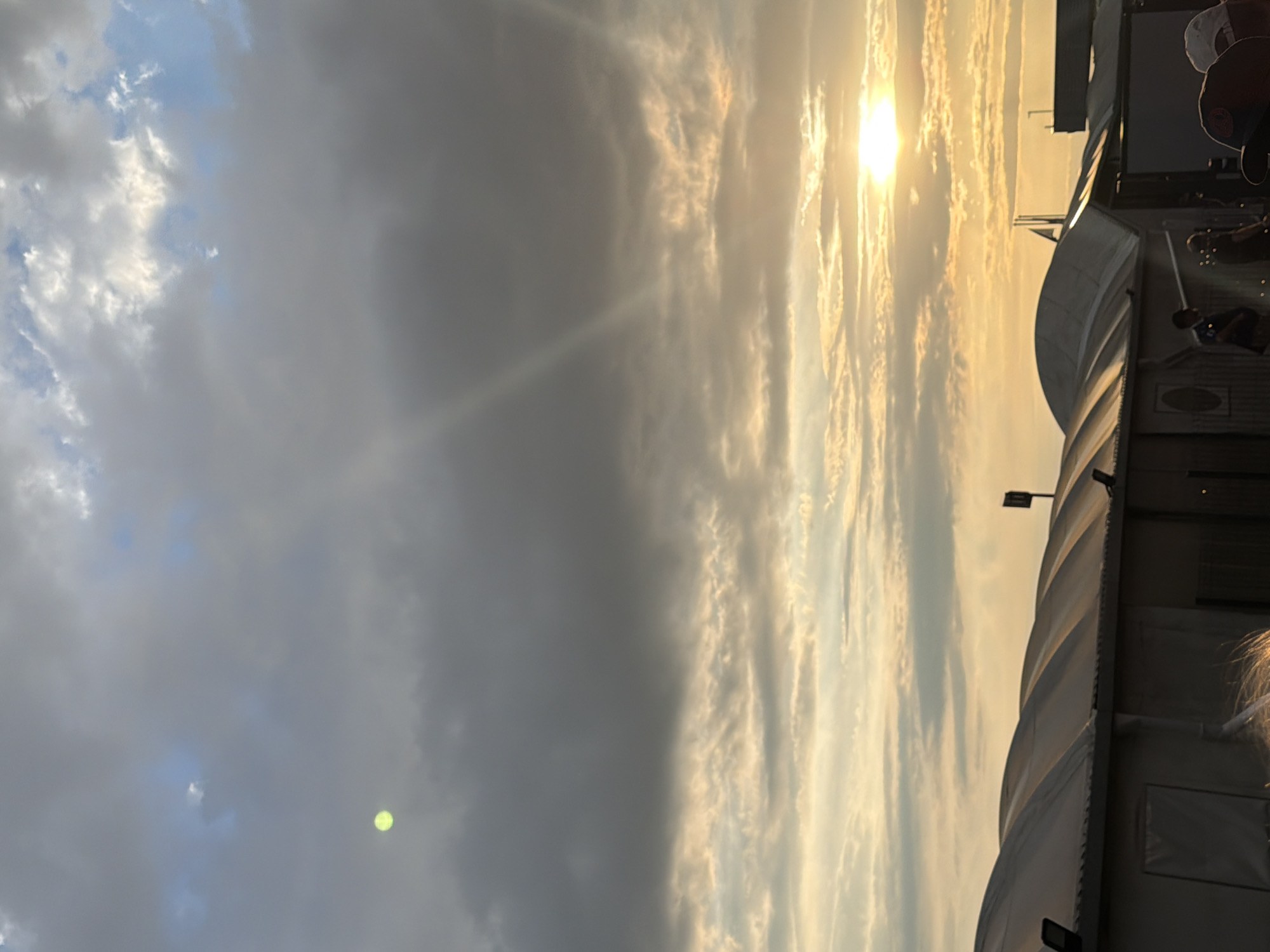 Evening queue outside Beauvais-Tillé Airport under a golden sunset