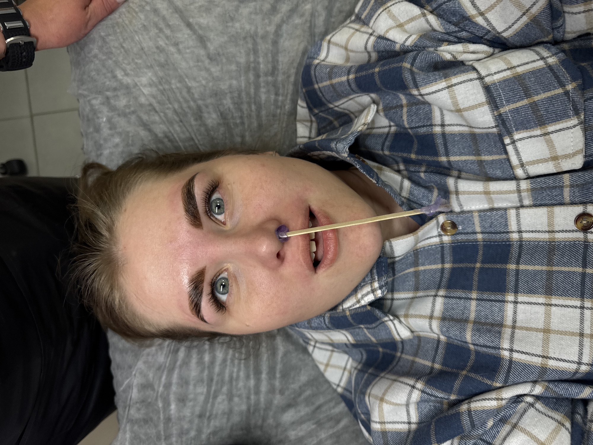 Woman receives eyebrow treatment at Perm beauty salon