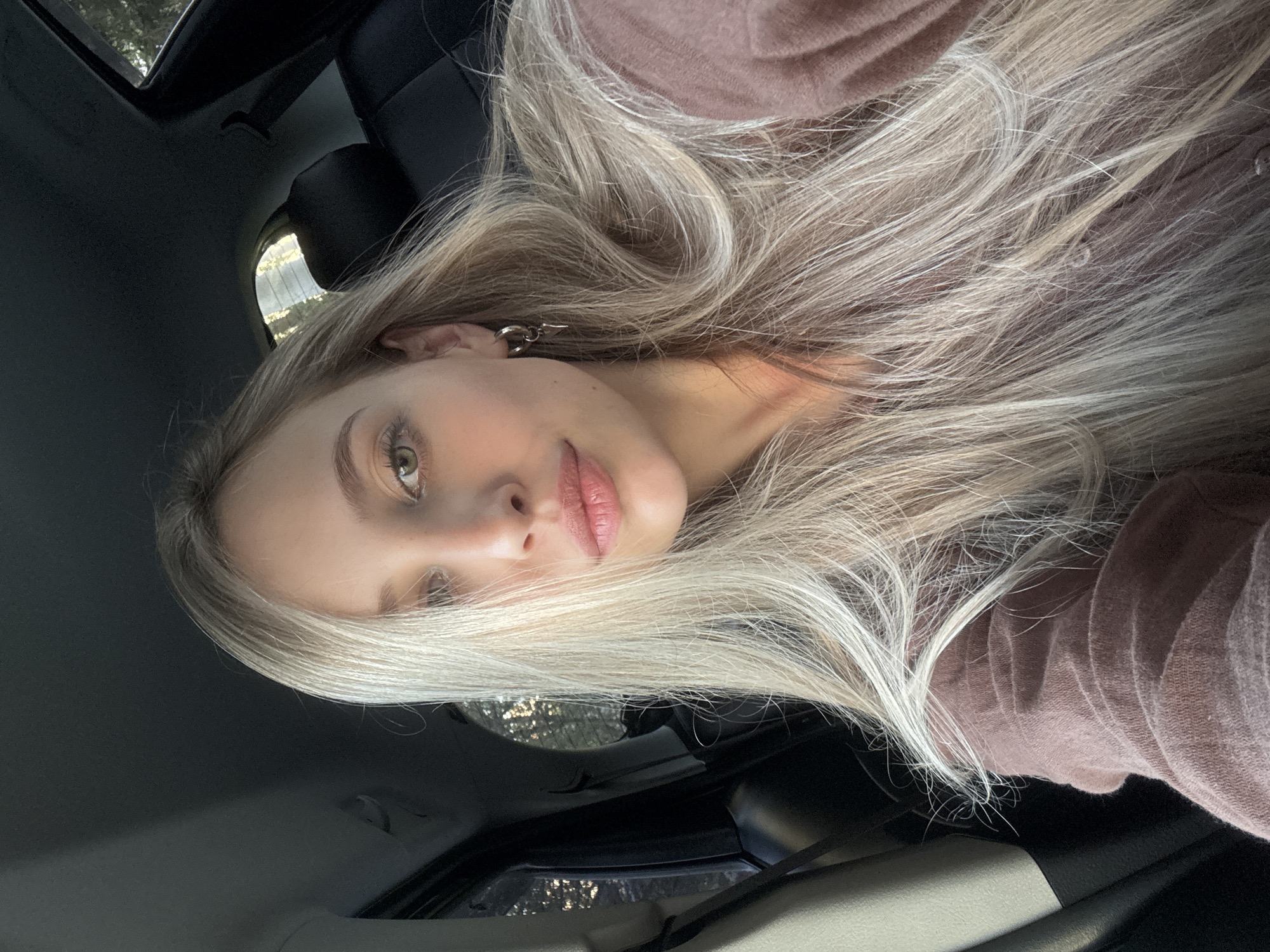 Selfie moment in a car amid Krasnoyarsk forest surroundings