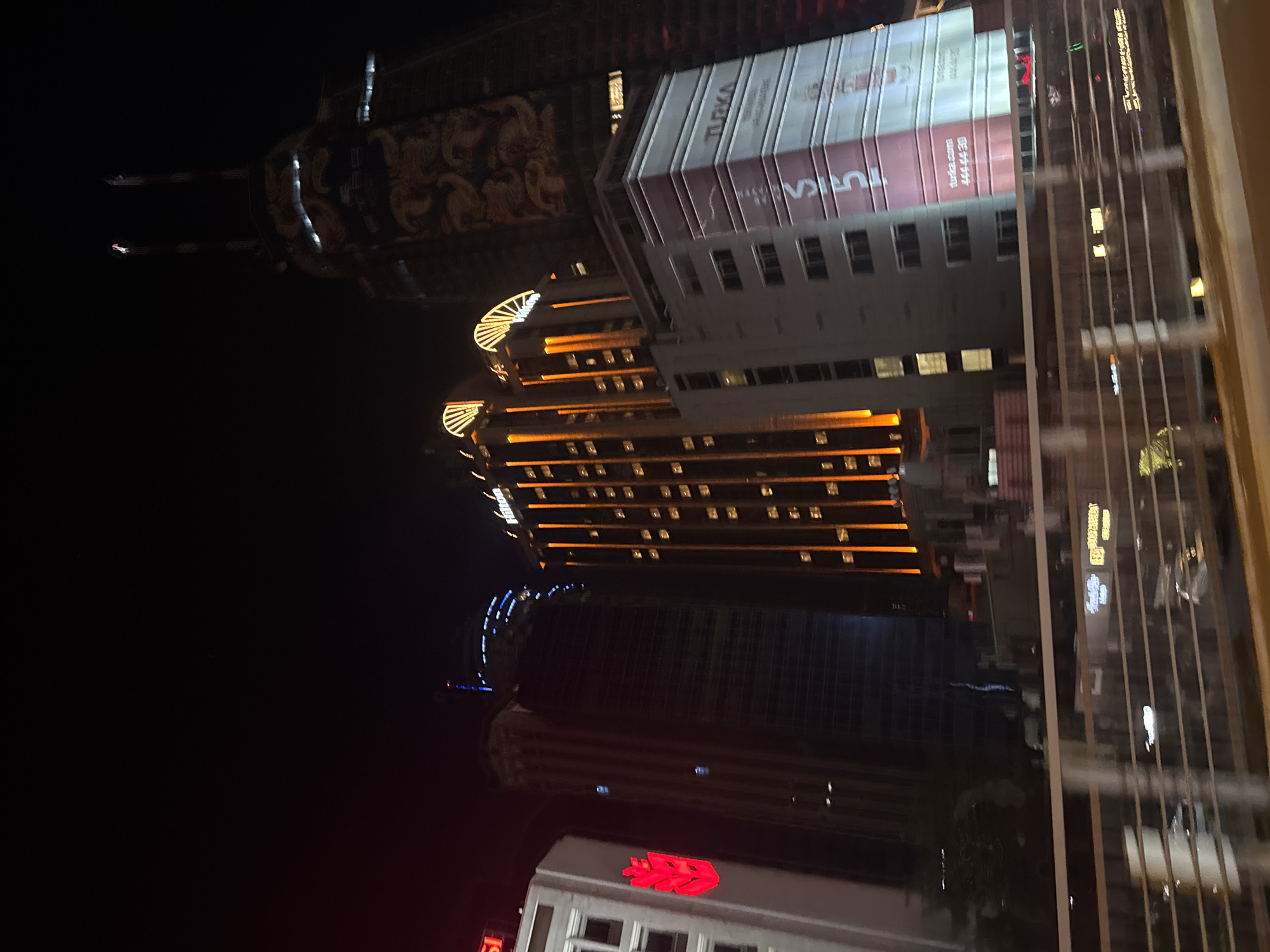 Nighttime cityscape observed through window in Sarıyer, Turkey