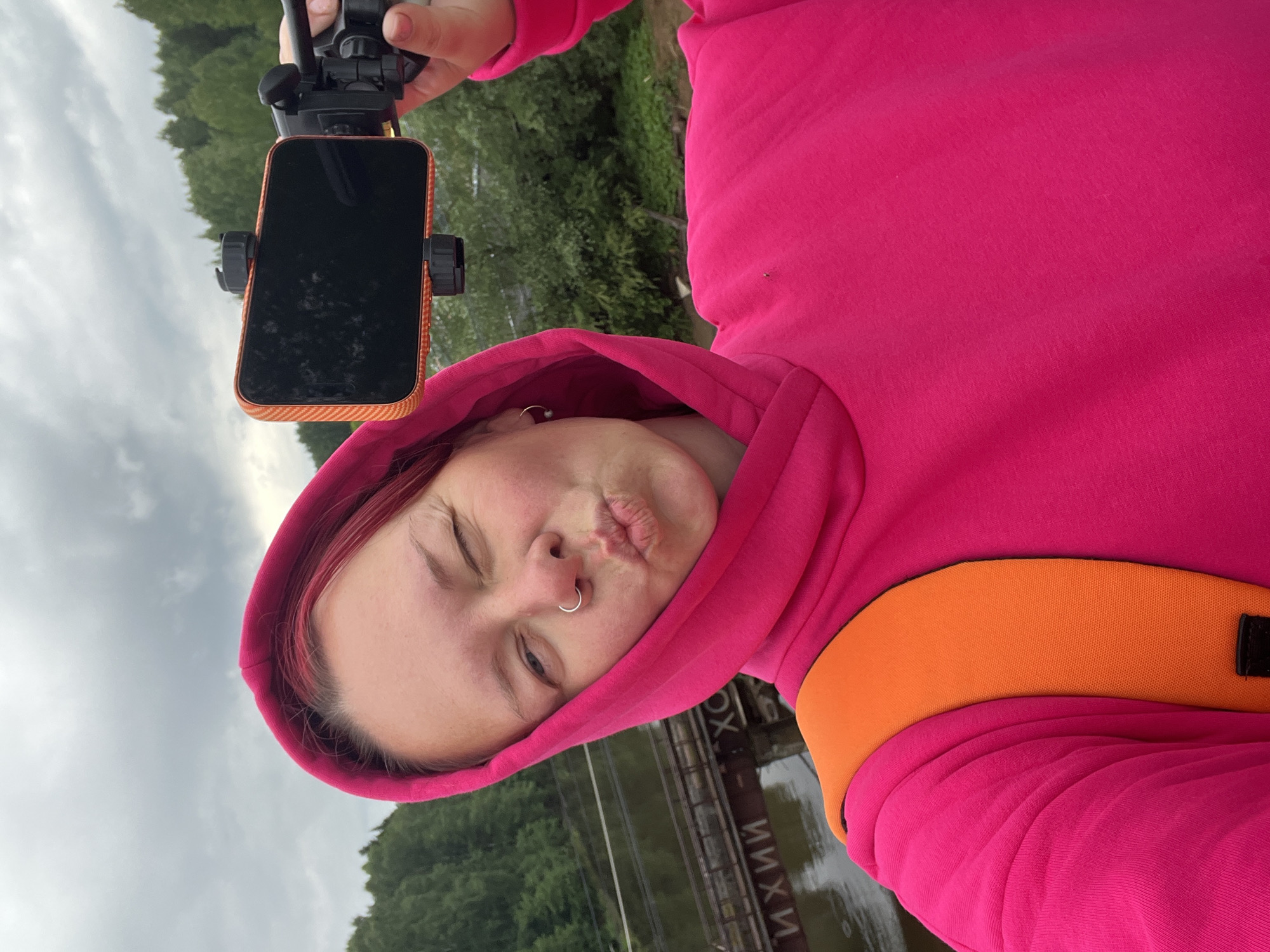 Couple photographs and performs stunts on Chaikovsky waterfront embankment