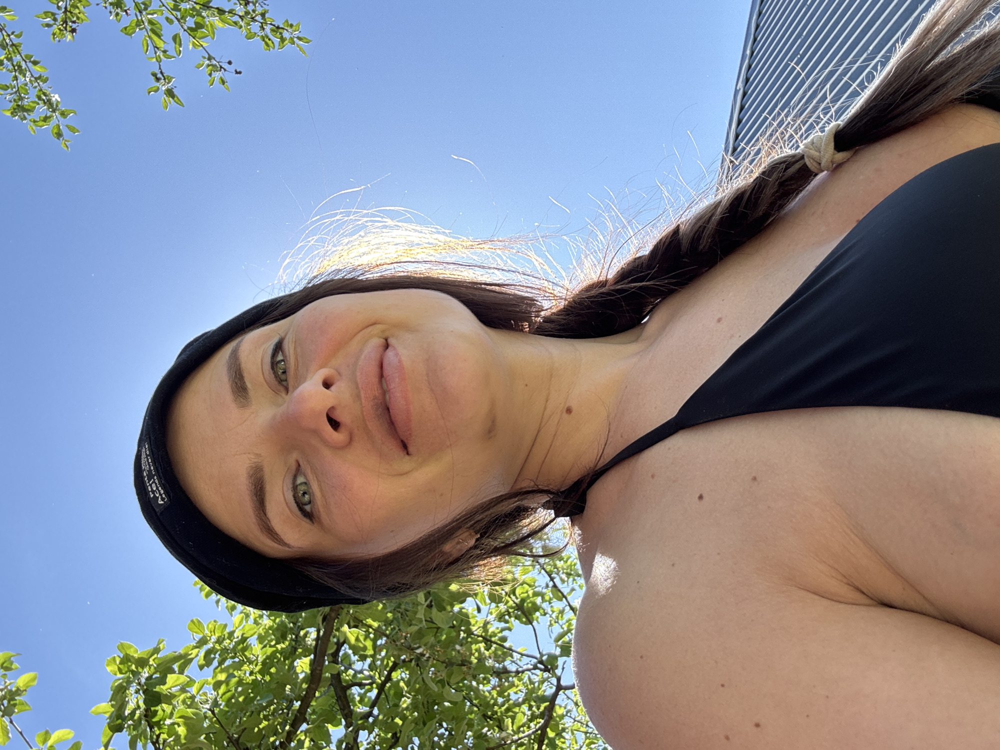 Woman and dogs spend morning moments in Rusalevka backyard