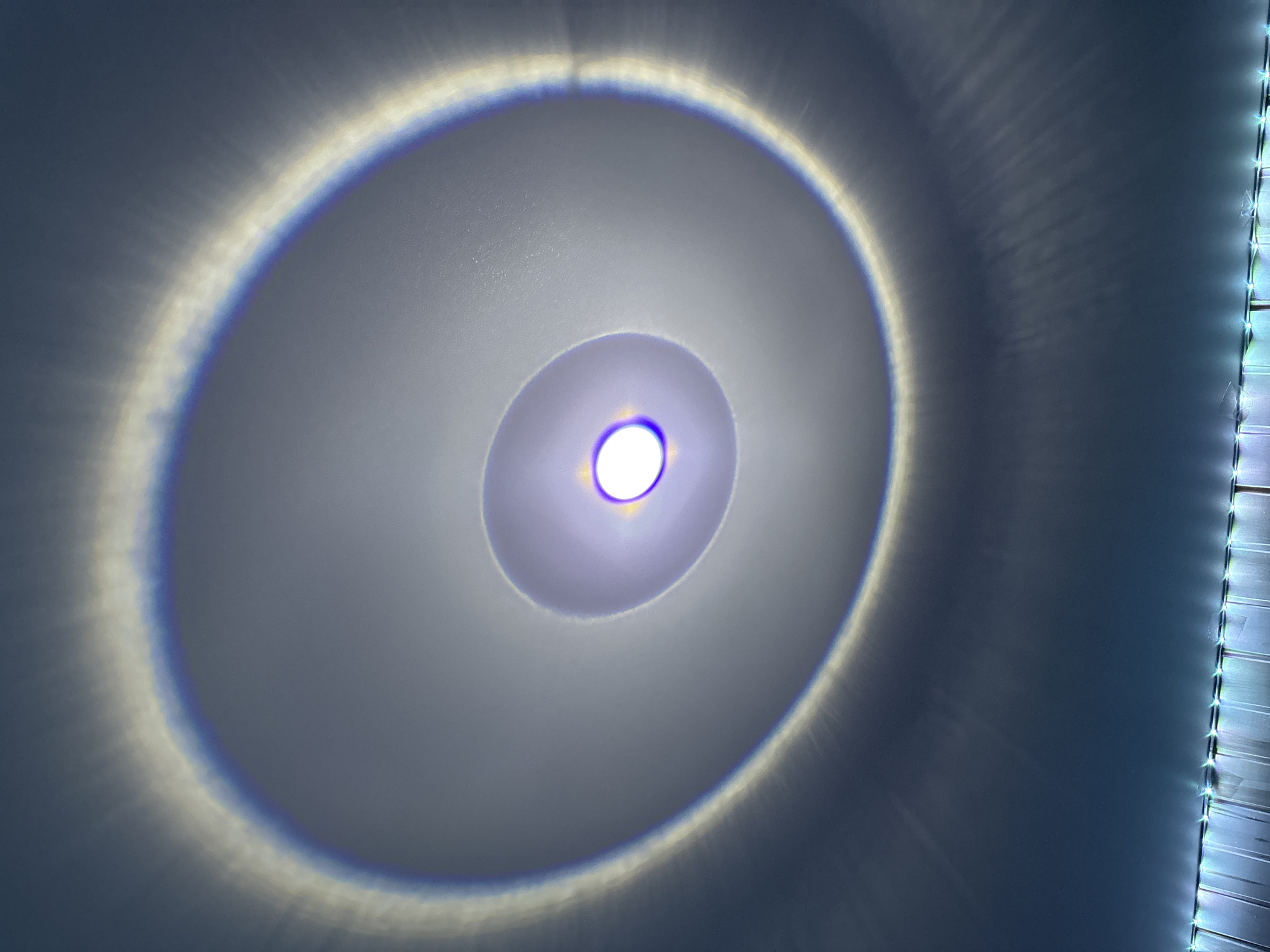Concentric light rings observed on wall in Rusalevka, Russia