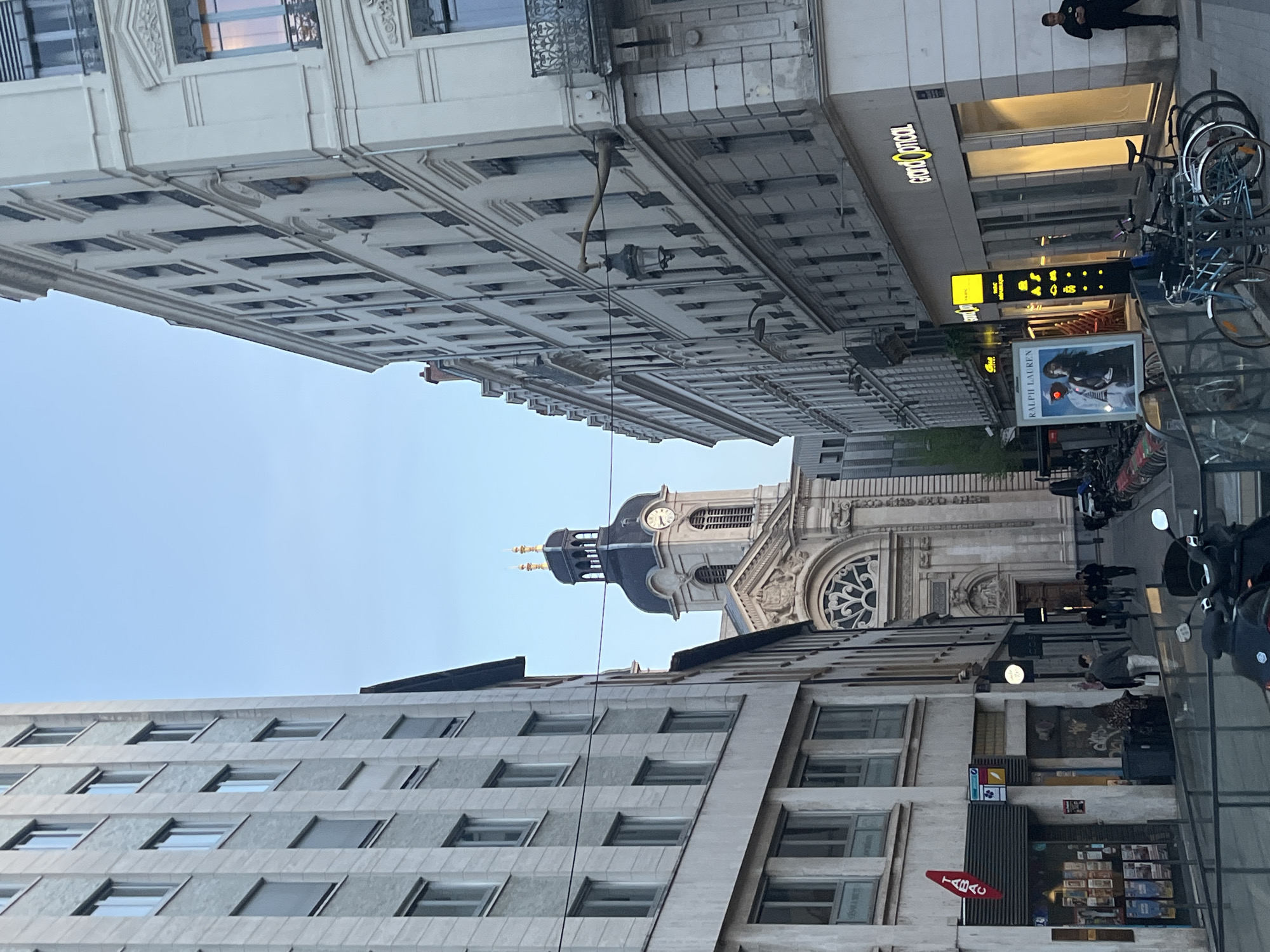 Street view captured in Lyon showing buildings, distant church tower