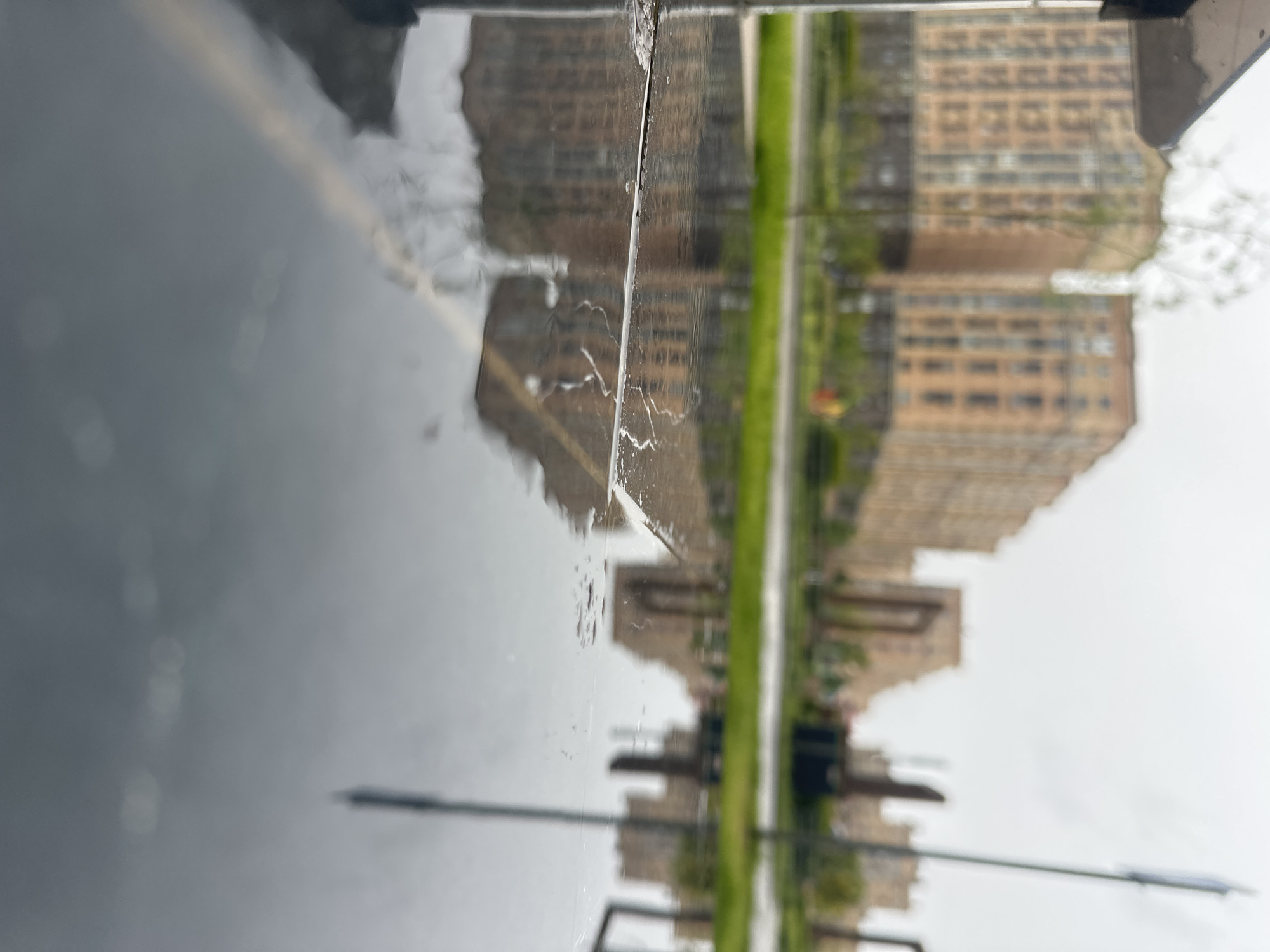 Wet morning reflections captured in Stavropol apartment district