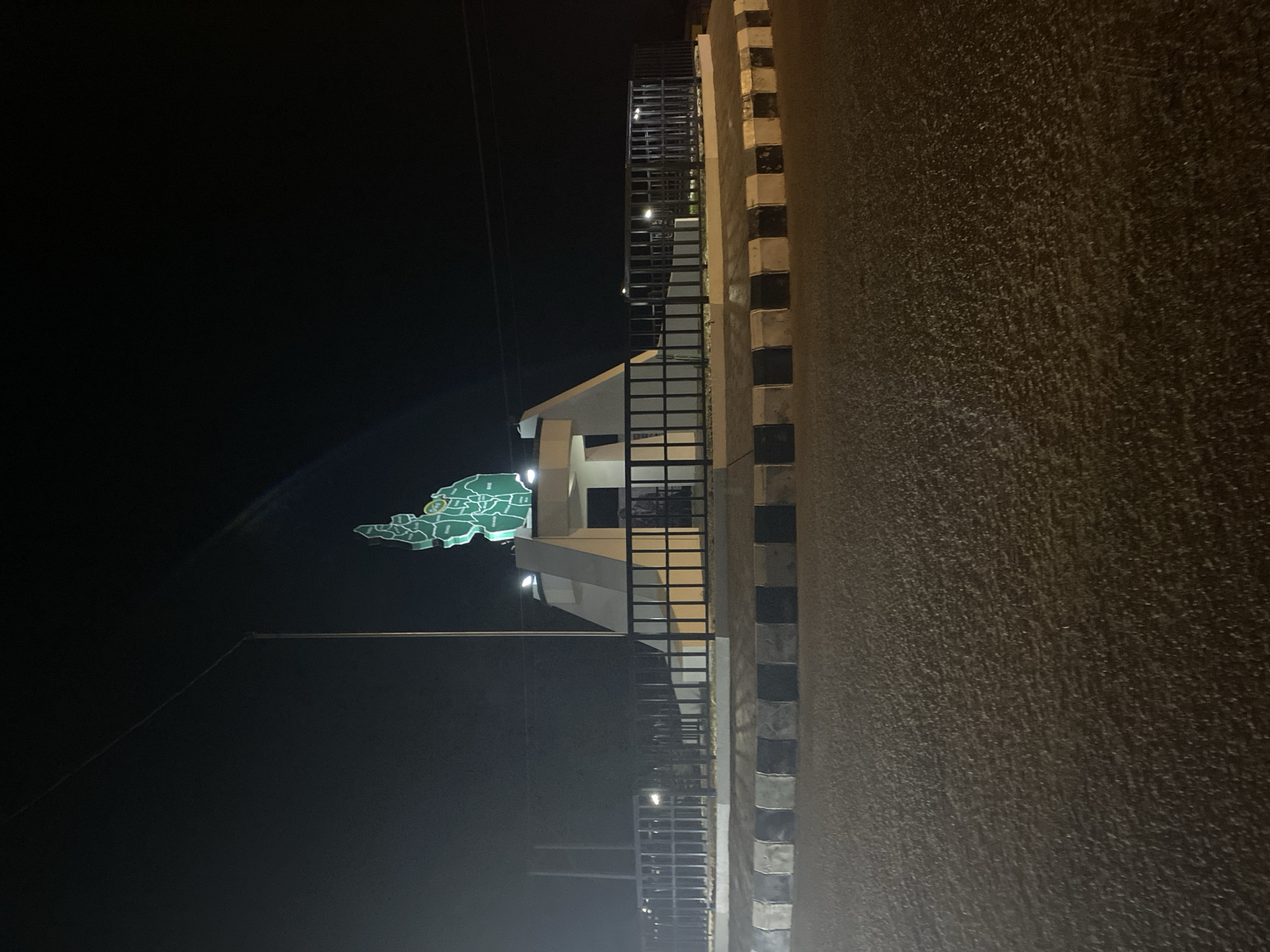 Illuminated Nigeria map monument photographed at night in Bukuru
