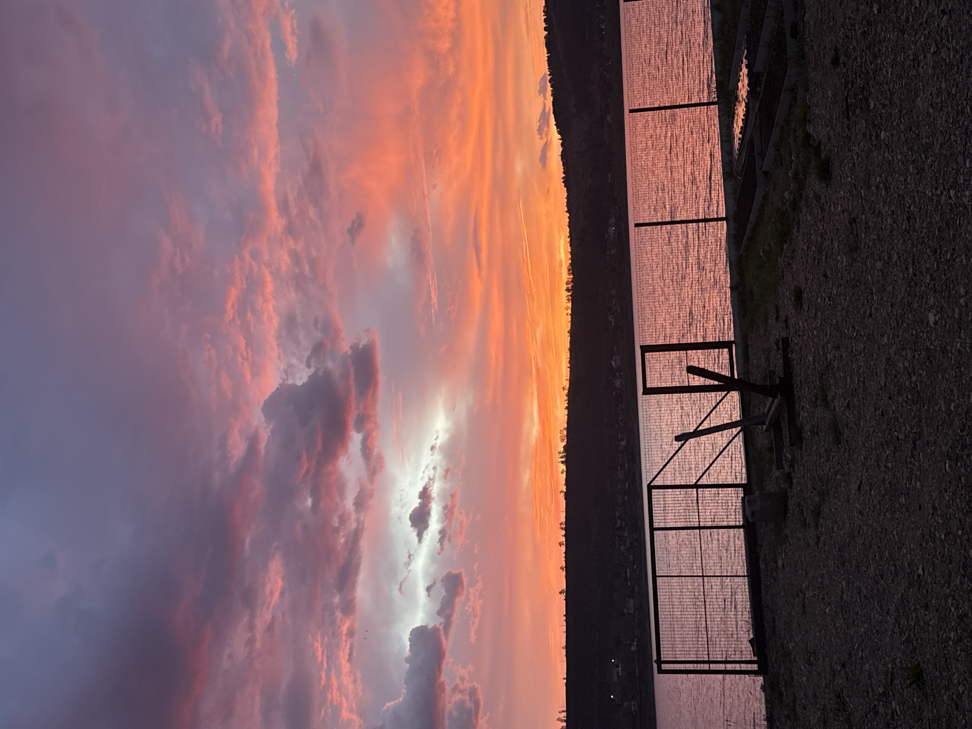 Colorful sunset observed over water in Irkutsk, Russia