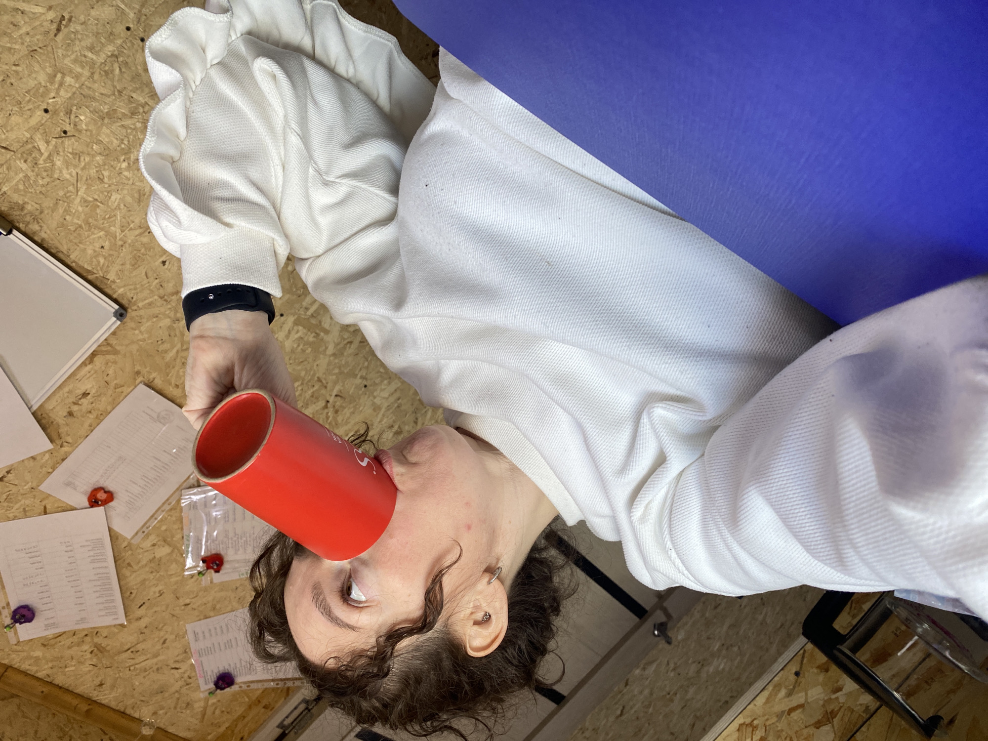 Woman takes selfies with coffee in Ol'khovskoye office