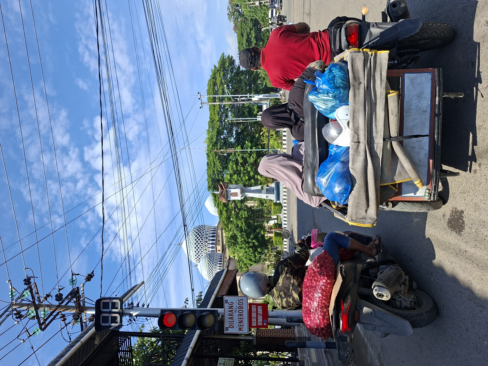 Daily life unfolds in Lhokseumawe: markets, cooking, transport, play