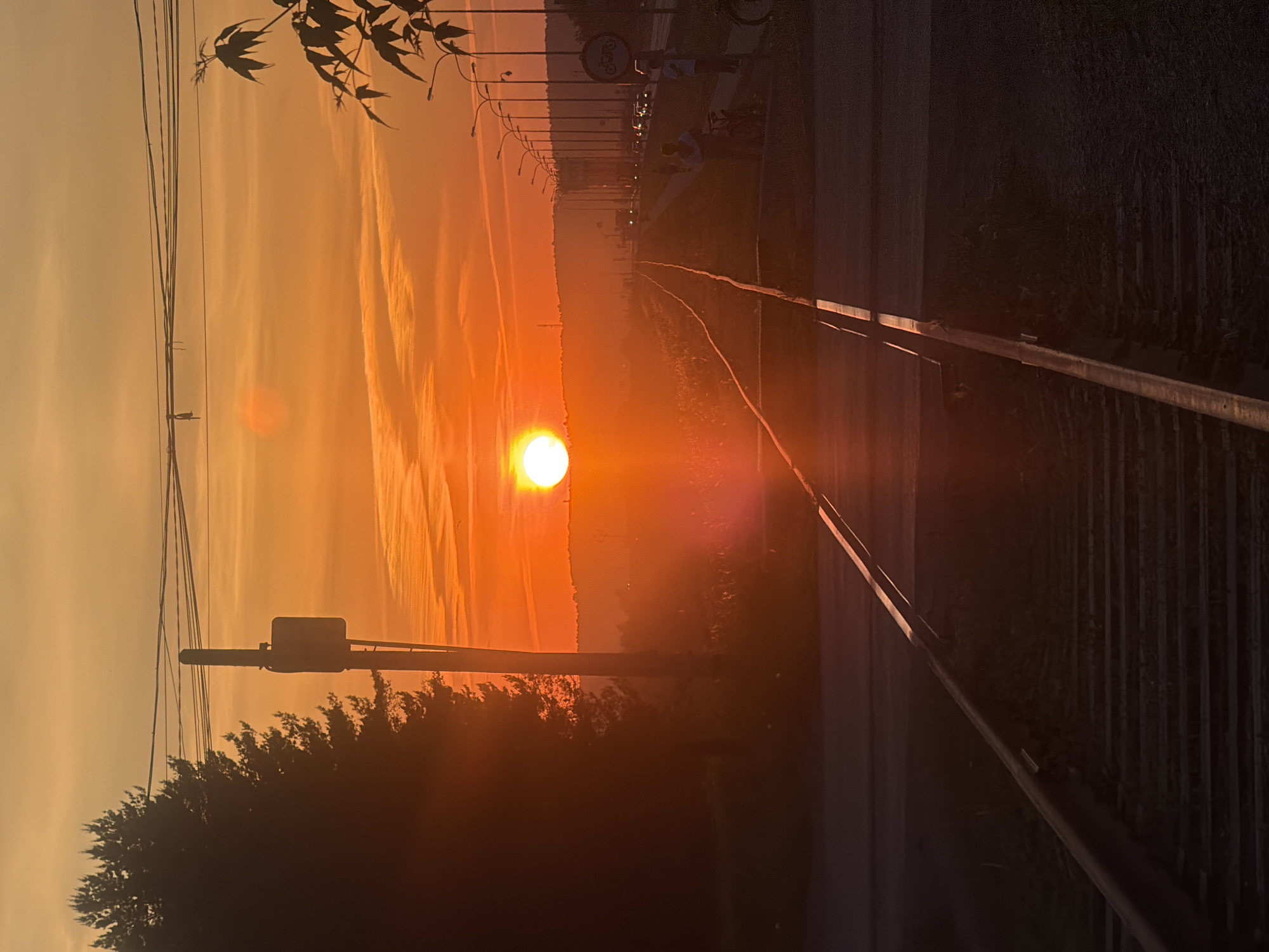 Sunset captured along railroad tracks in Chaikovsky, Russia