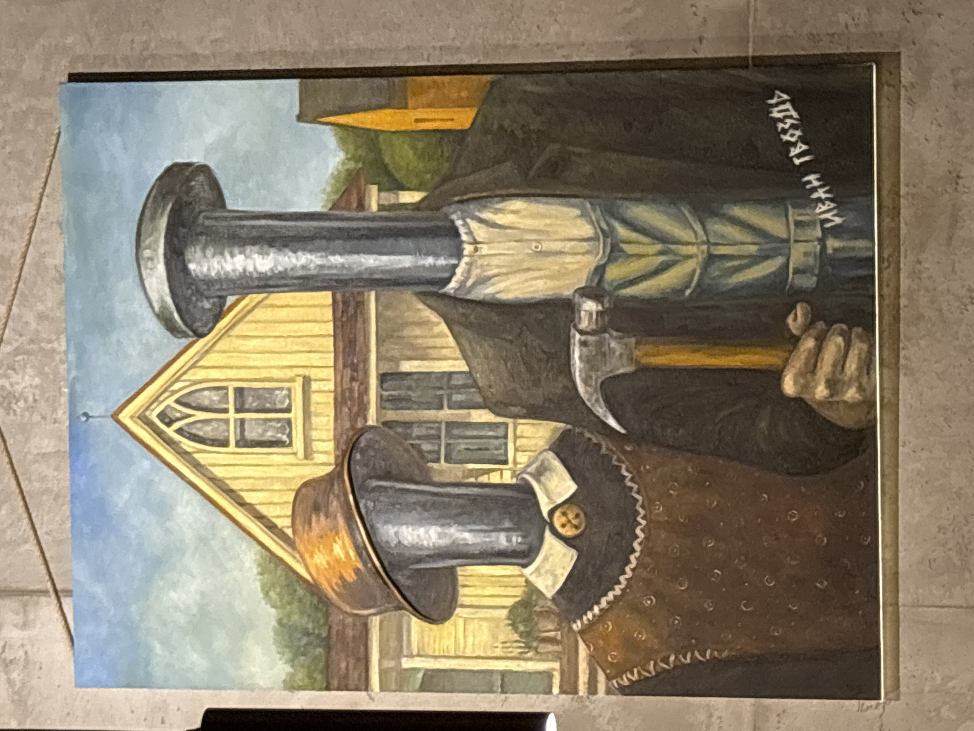 Art display features hammer painting and Munch-style artwork
