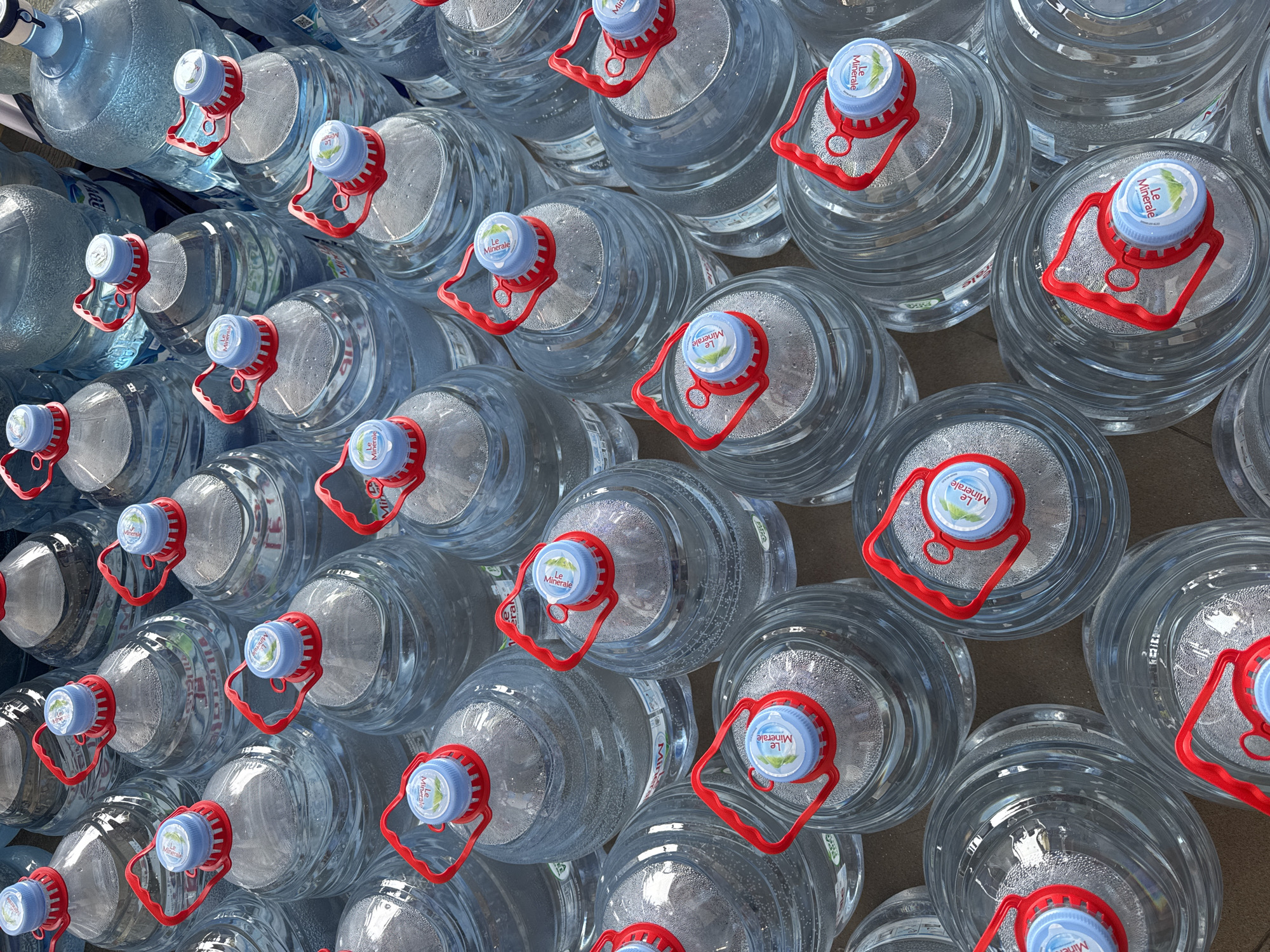 Water bottles arranged densely in Kuta Selatan, Indonesia