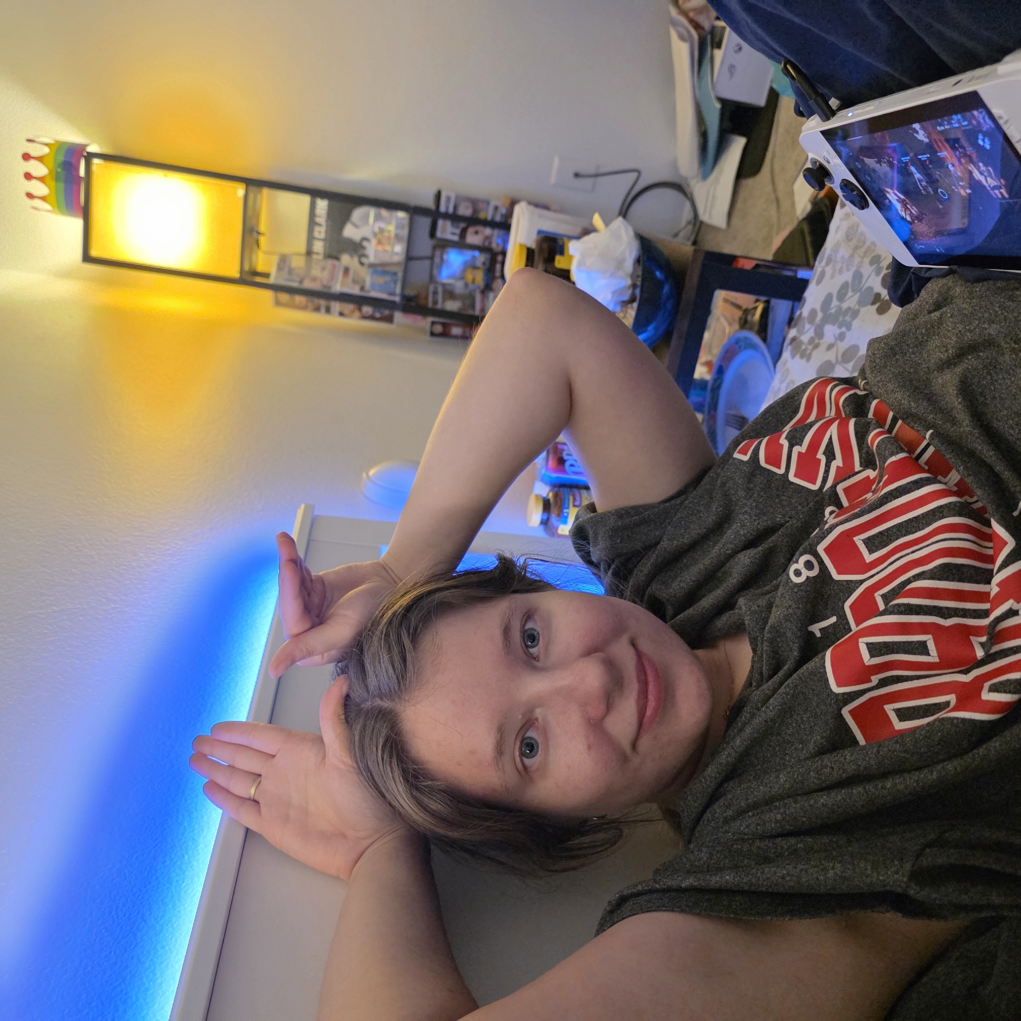 Late-night bedroom hang with a cat and a controller